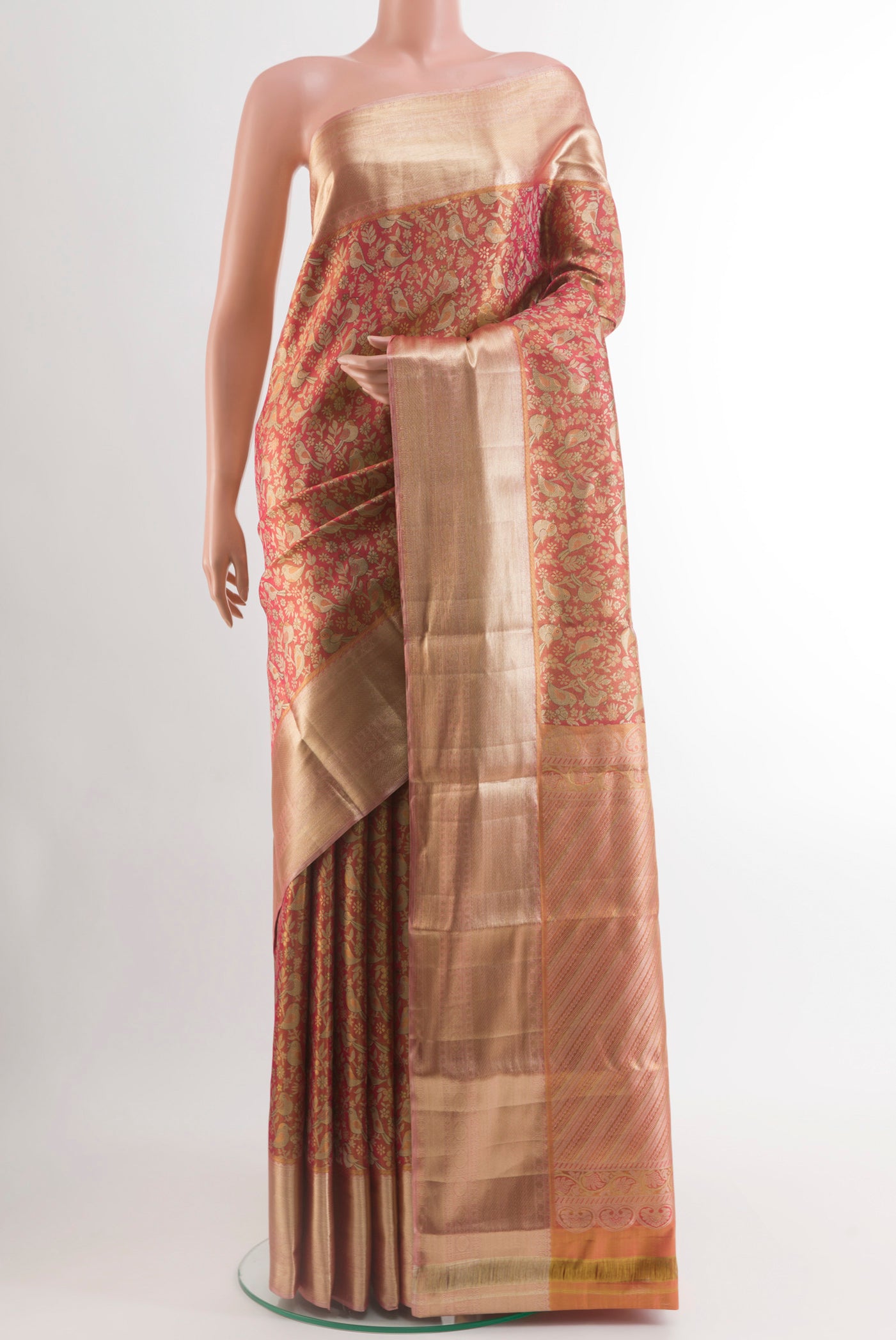 Pink Kanjivaram Tissue Silk Saree with Zari Brocade on the body and Zari Border.  displayed on a mannequin