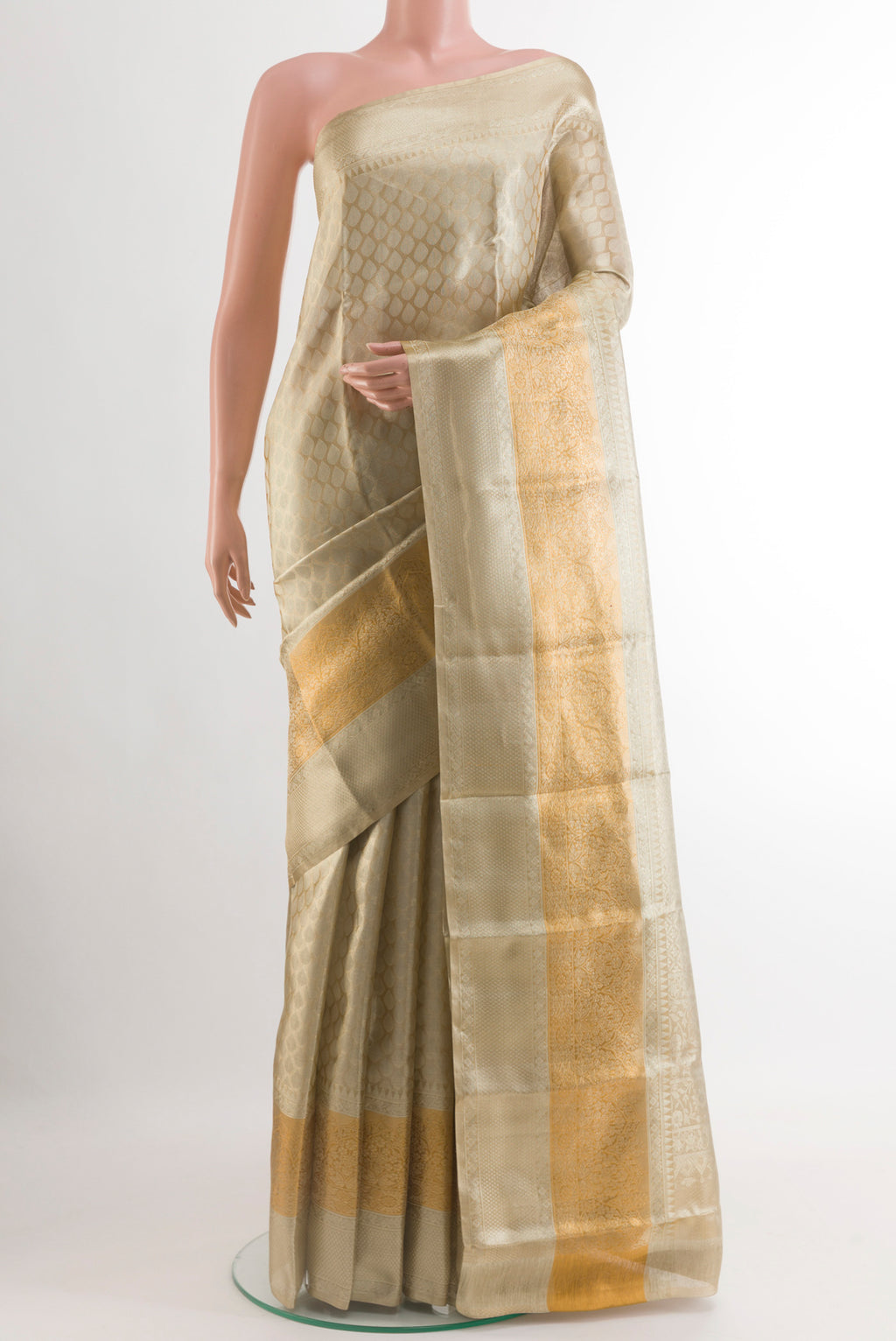 Silver Kanjivaram Tissue Silk Saree with Zari Brocade on the body and Zari Border.  displayed on a mannequin