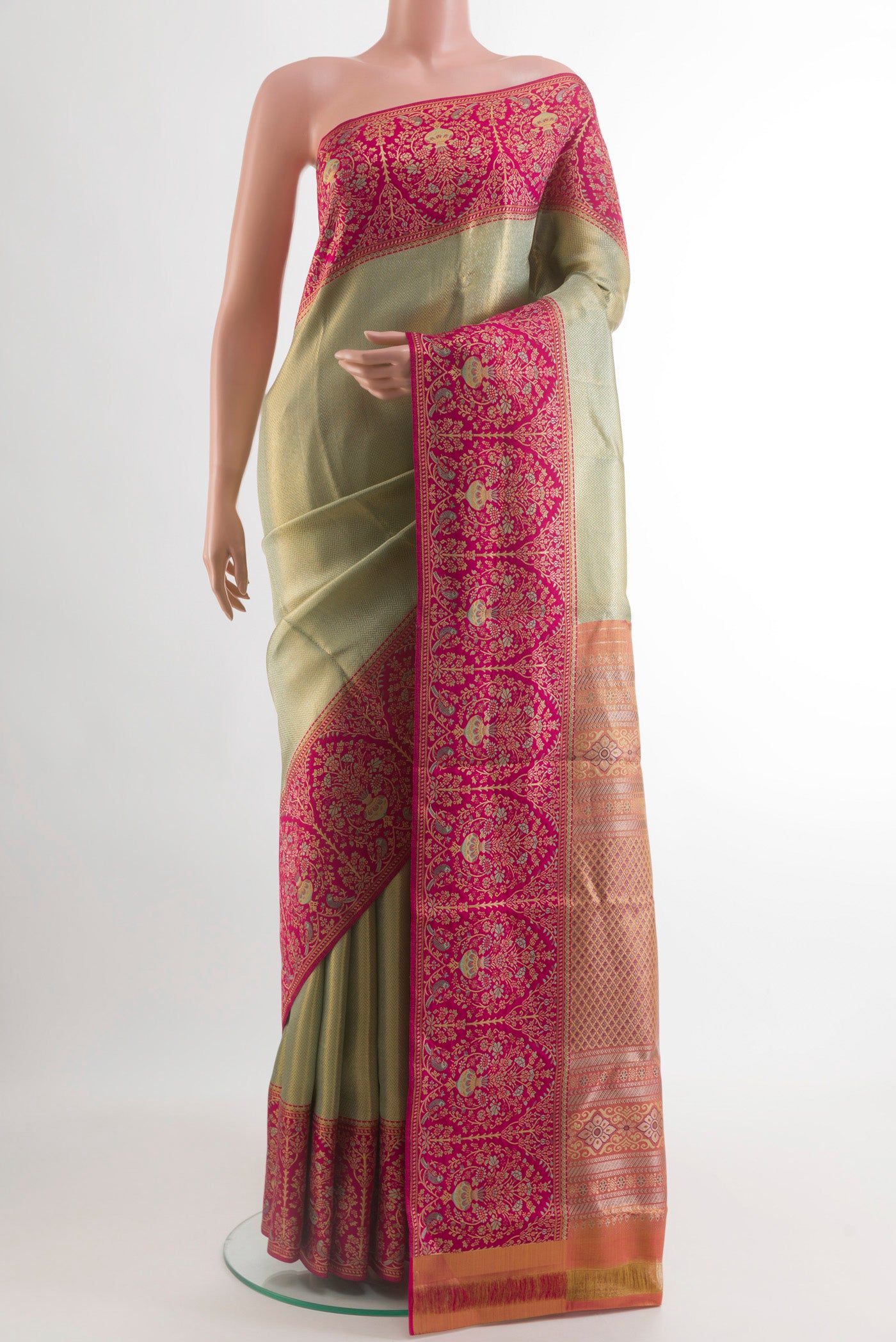 Light Green Kanchipuram Tissue Silk Saree with Zari Brocade on the body and Zari Border.  displayed on a mannequin