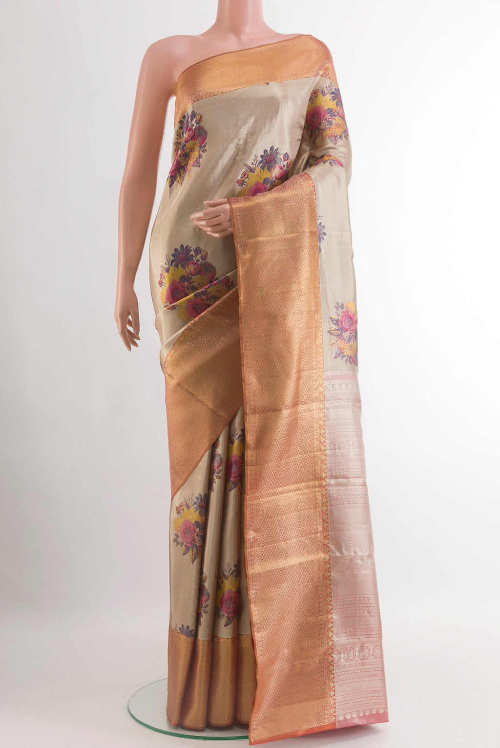Rose Gold Kanchipuram Tissue Silk Saree with Zari Brocade on the body and Zari Border.  displayed on a mannequin