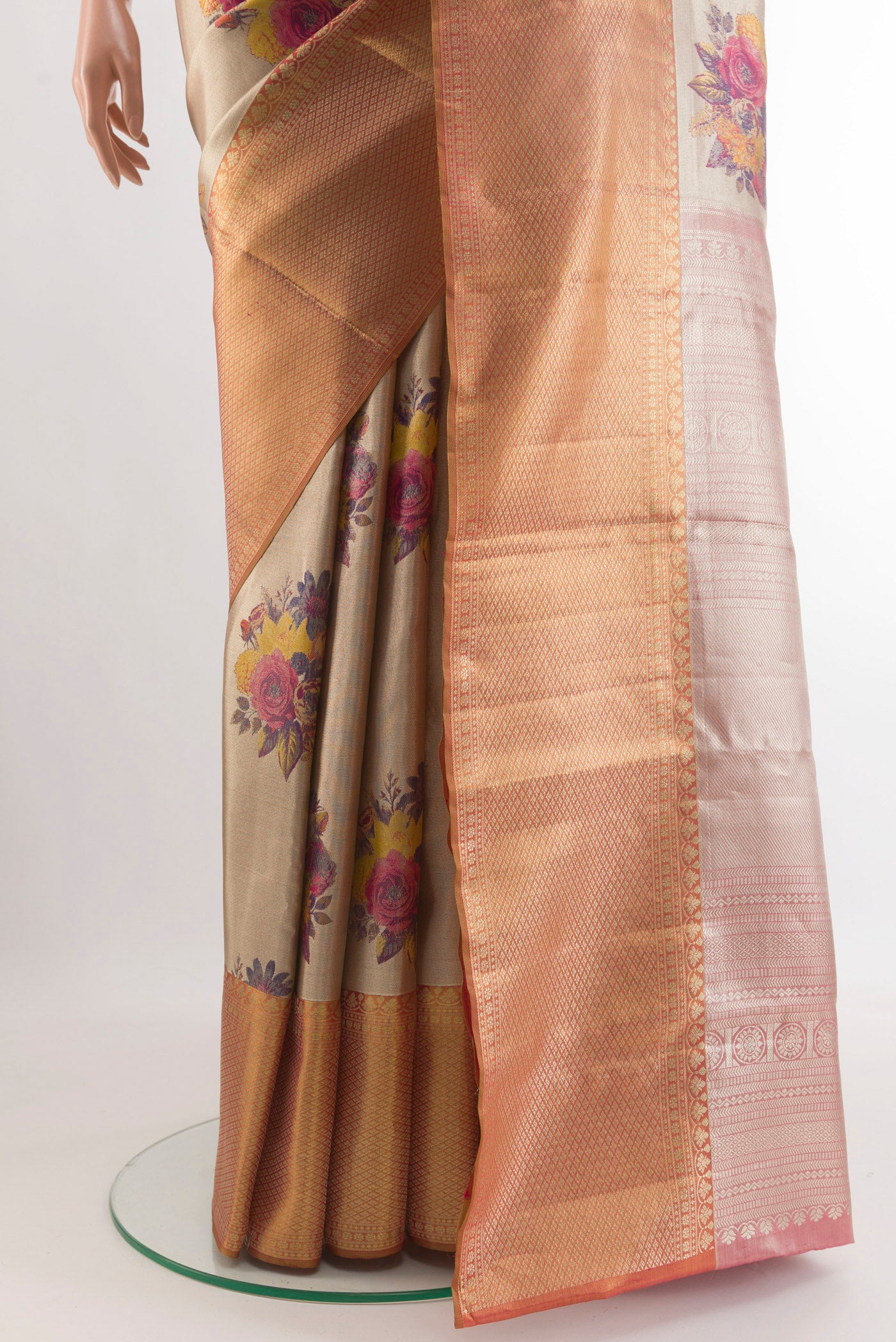 Pleats and pallu of Rose Gold Kanchipuram Tissue Silk Saree with Zari Brocade on the body and Zari Border. 