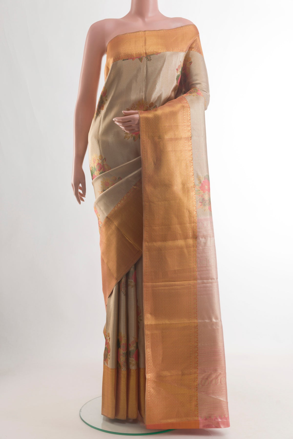 Golden Kanchipuram Tissue Silk Saree with Zari Brocade on the body and Zari Border.  displayed on a mannequin