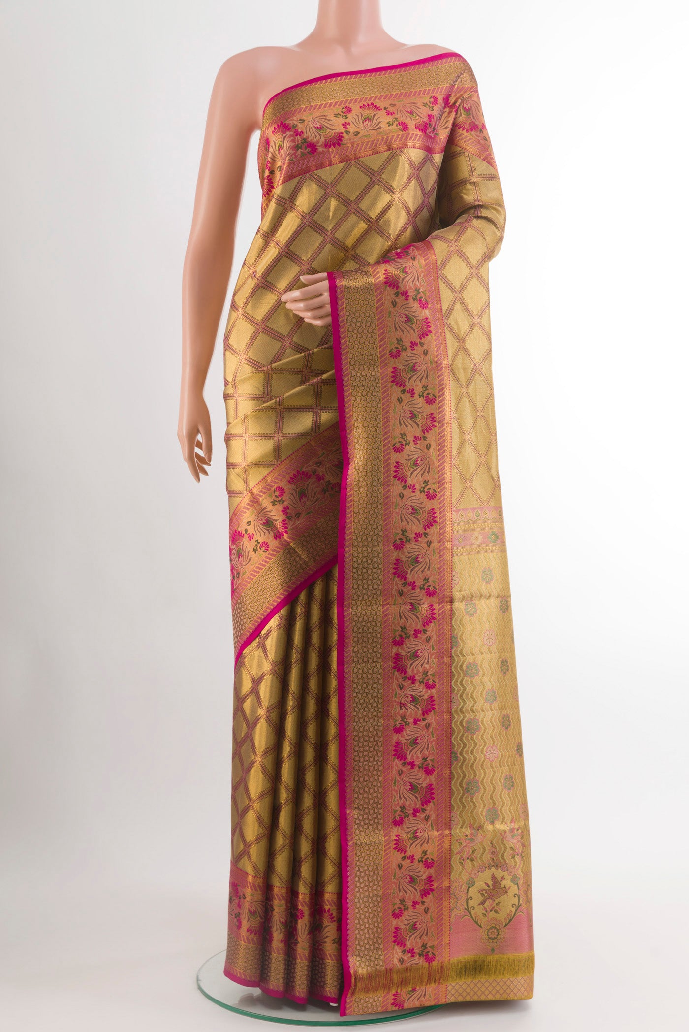 Golden Kanchipuram Tissue Silk Saree with Zari Brocade on the body and Zari Border.  displayed on a mannequin