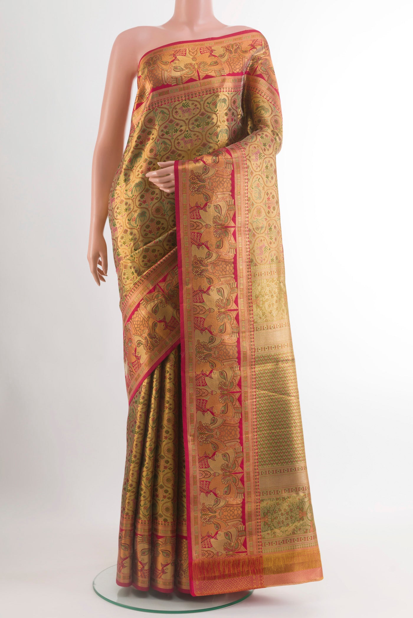 Golden Kanchipuram Tissue Silk Saree with Zari Brocade on the body and Zari Border.  displayed on a mannequin
