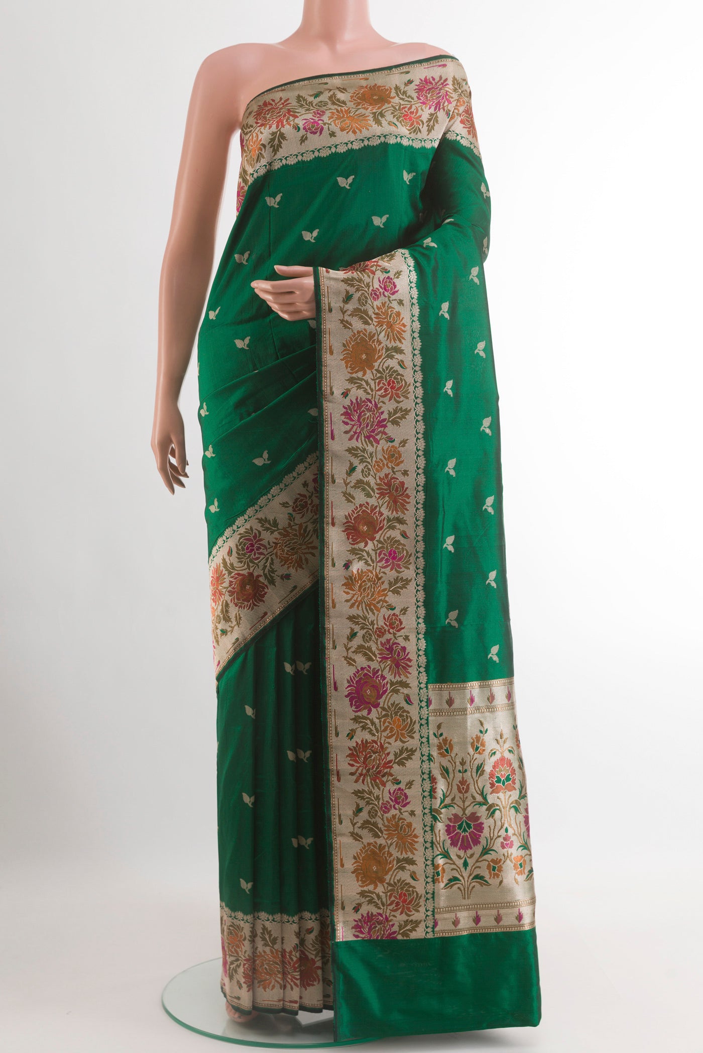 Bottle Green Banarasi Silk Saree with Zari Butta on the body and Zari Border.  displayed on a mannequin