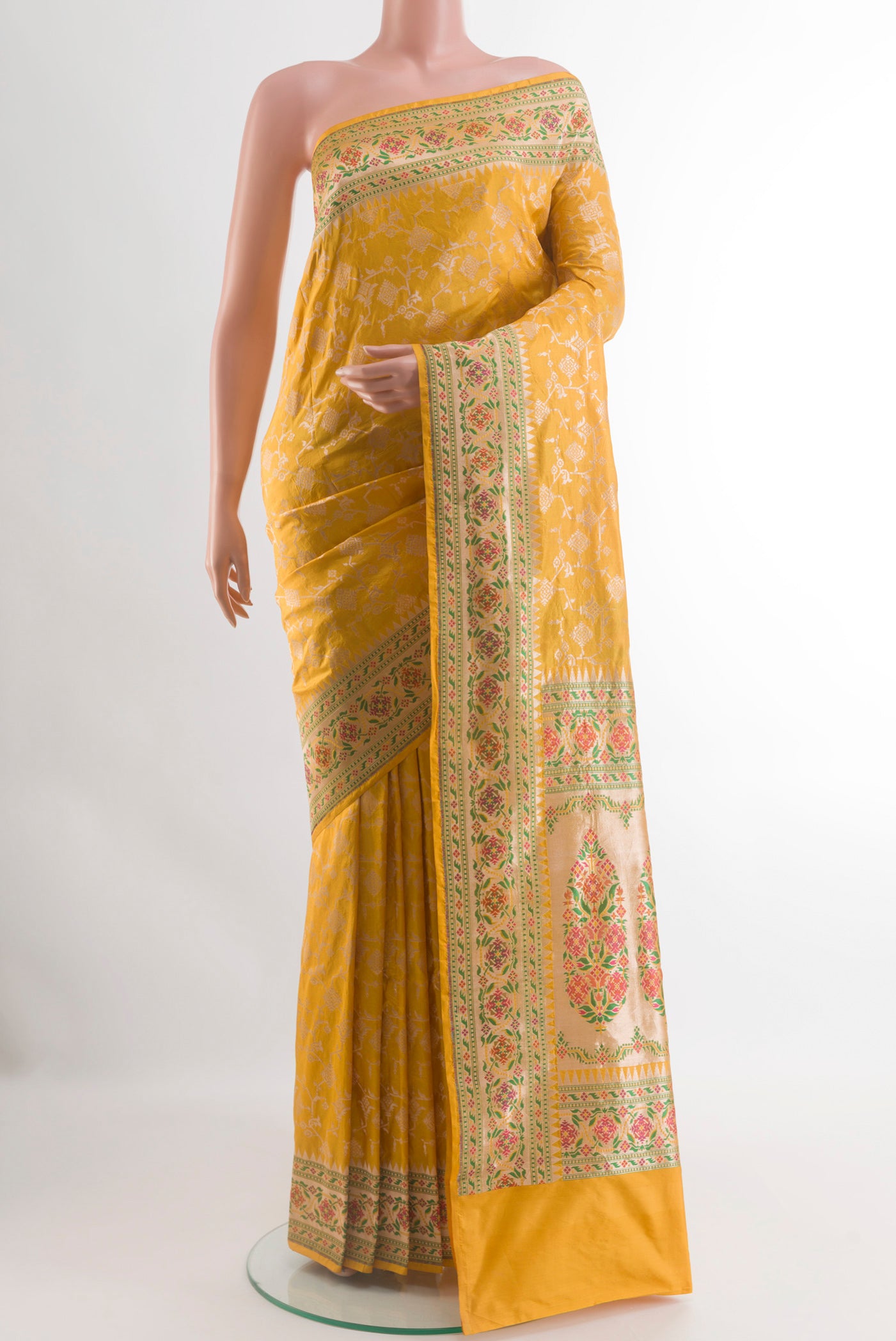 Yellow Banarasi Silk Saree with Zari Brocade on the body and Paithani Border.  displayed on a mannequin