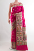 Pink Banarasi Silk Saree with Zari Butta on the body and Paithani Border.  displayed on a mannequin