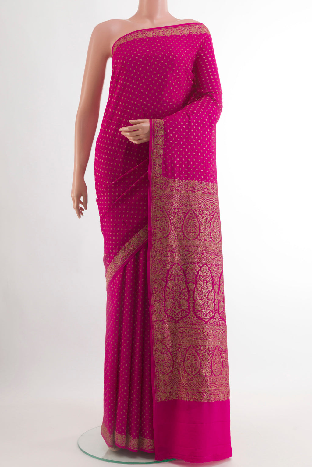 Rani Pink Banarasi Georgette Saree with Zari Butta on the body and Zari Border.  displayed on a mannequin