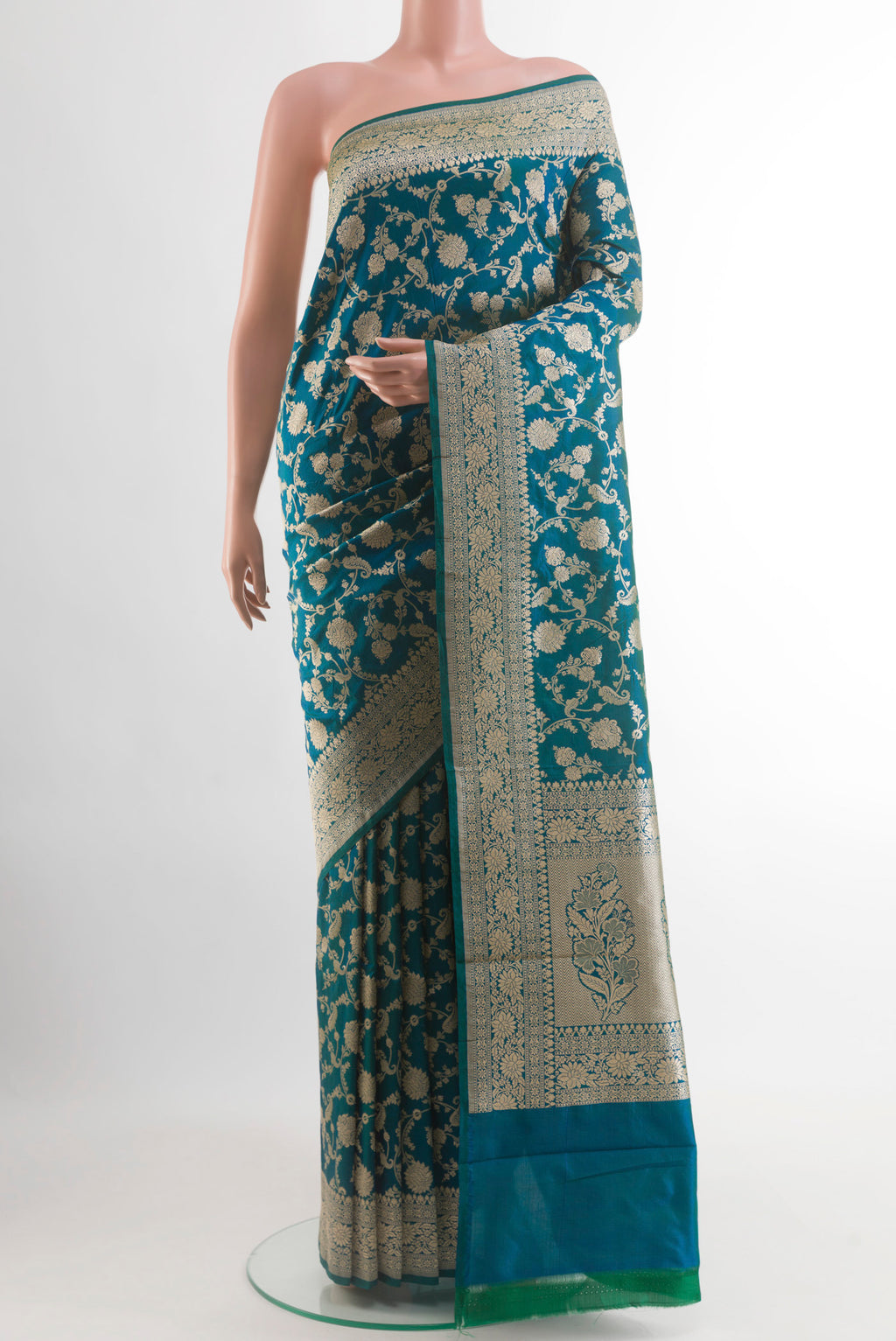 Peacock Blue Banarasi Silk Saree with Zari Brocade on the body and Zari Border.  displayed on a mannequin
