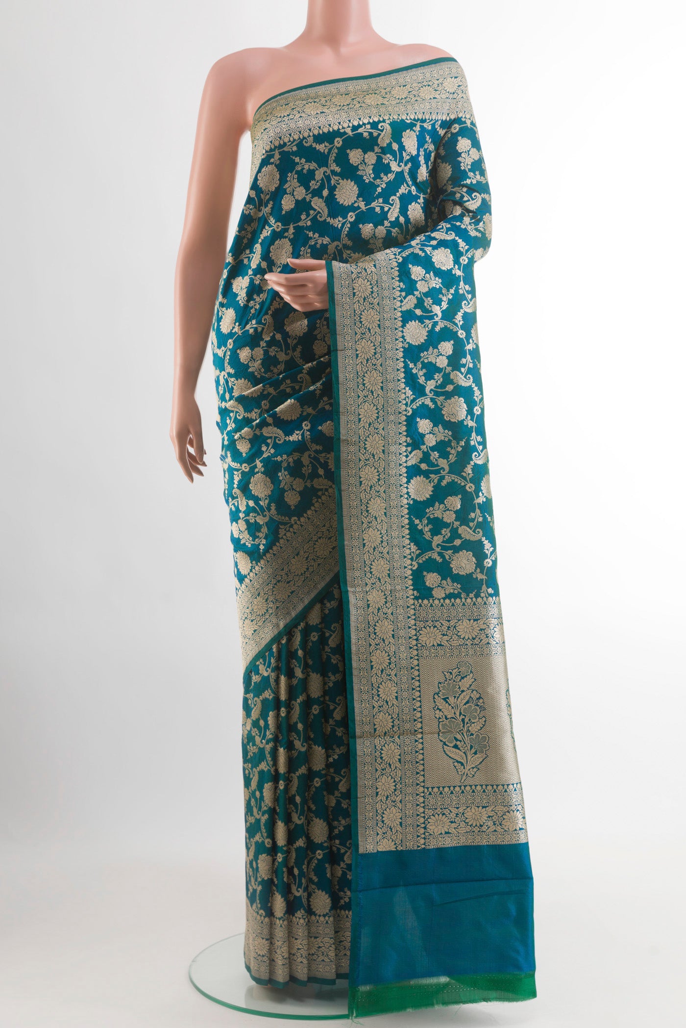 Peacock Blue Banarasi Silk Saree with Zari Brocade on the body and Zari Border.  displayed on a mannequin