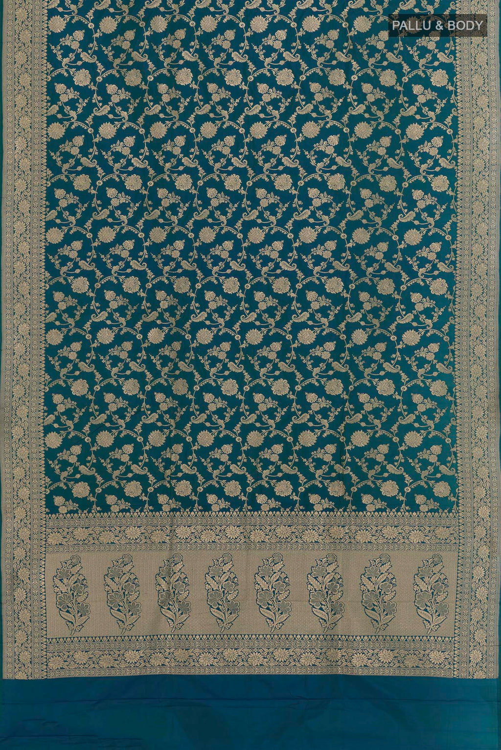 Flat view of Peacock Blue Banarasi Silk Saree with Zari Brocade on the body and Zari Border. 