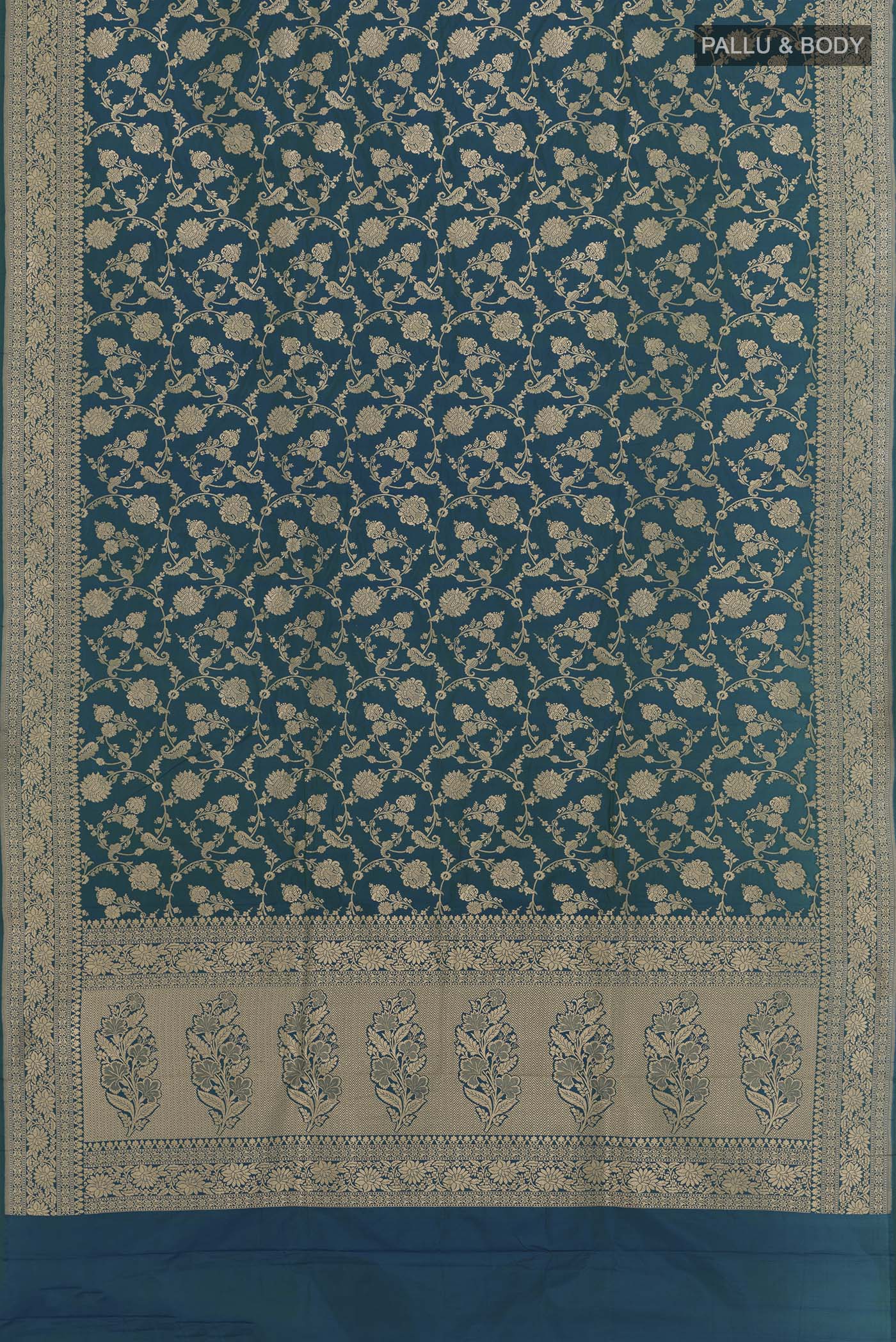 Flat view of Peacock Blue Banarasi Silk Saree with Zari Brocade on the body and Zari Border. 