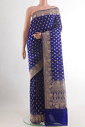 Blue Banarasi Katan Silk Saree with Zari Butta on the body and Zari Border.  displayed on a mannequin