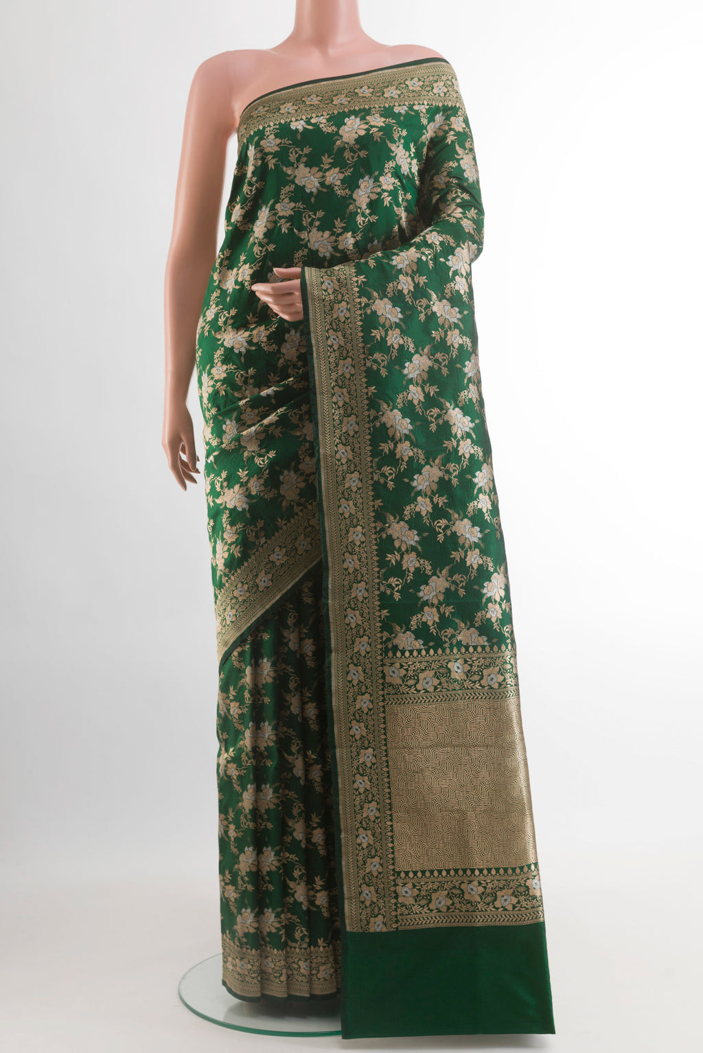 Bottle Green Banarasi Silk Saree with Zari Brocade on the body and Zari Border.  displayed on a mannequin