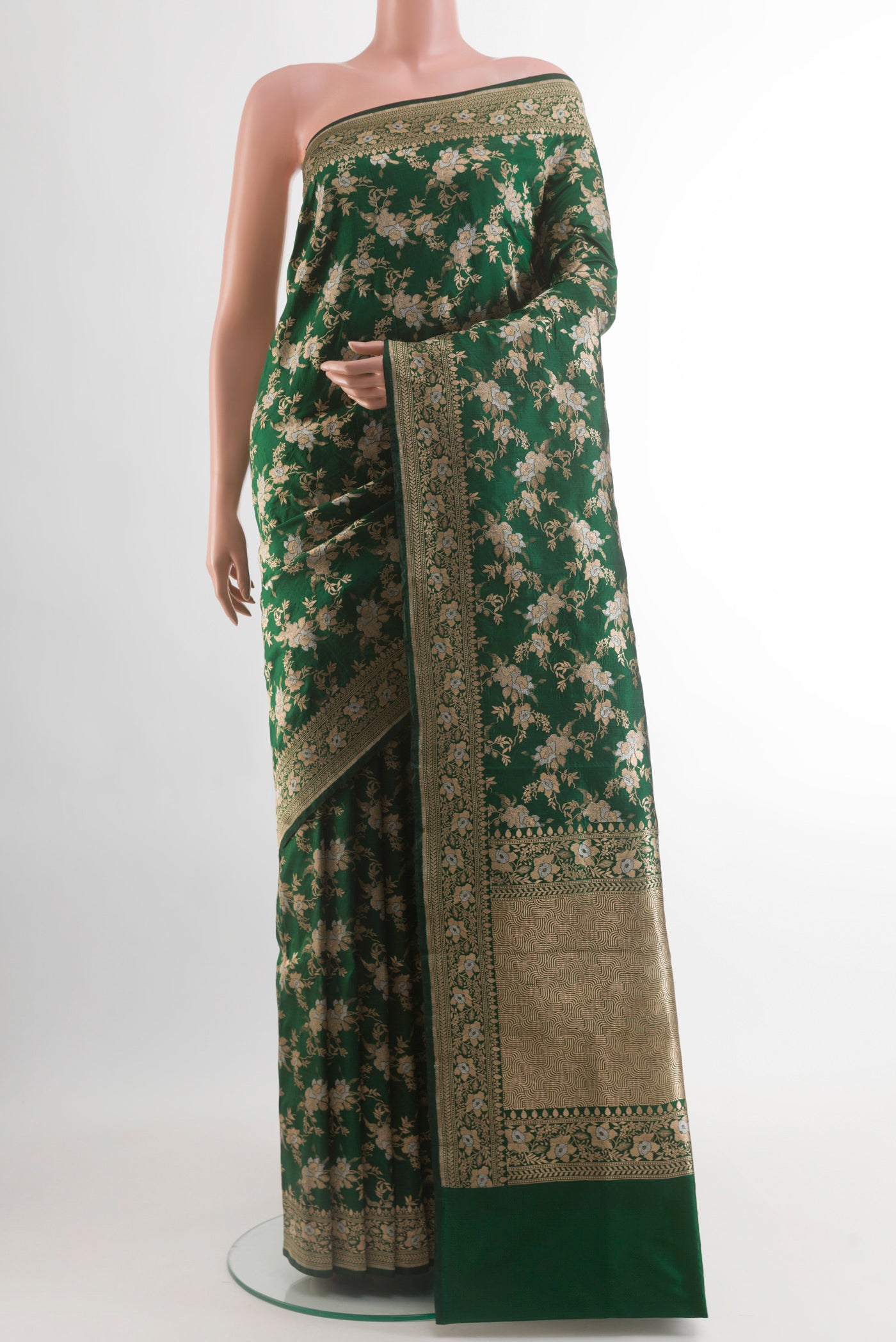 Bottle Green Banarasi Silk Saree with Zari Brocade on the body and Zari Border.  displayed on a mannequin