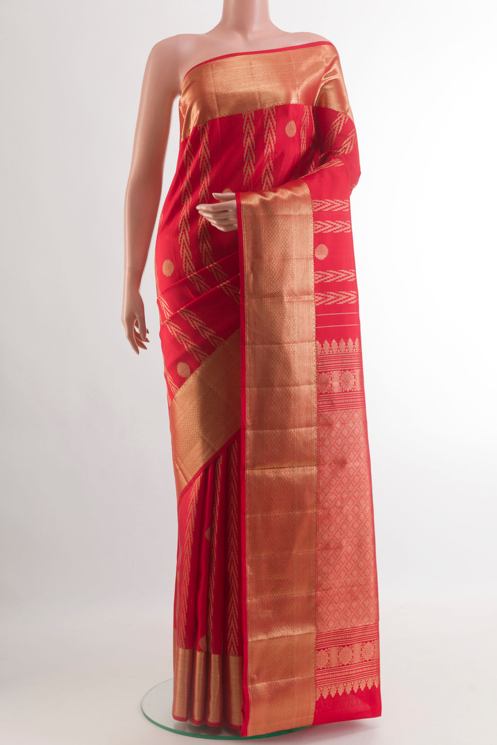 Red Kanjivaram Silk Saree with Zari Butta on the body and Zari Border.  displayed on a mannequin