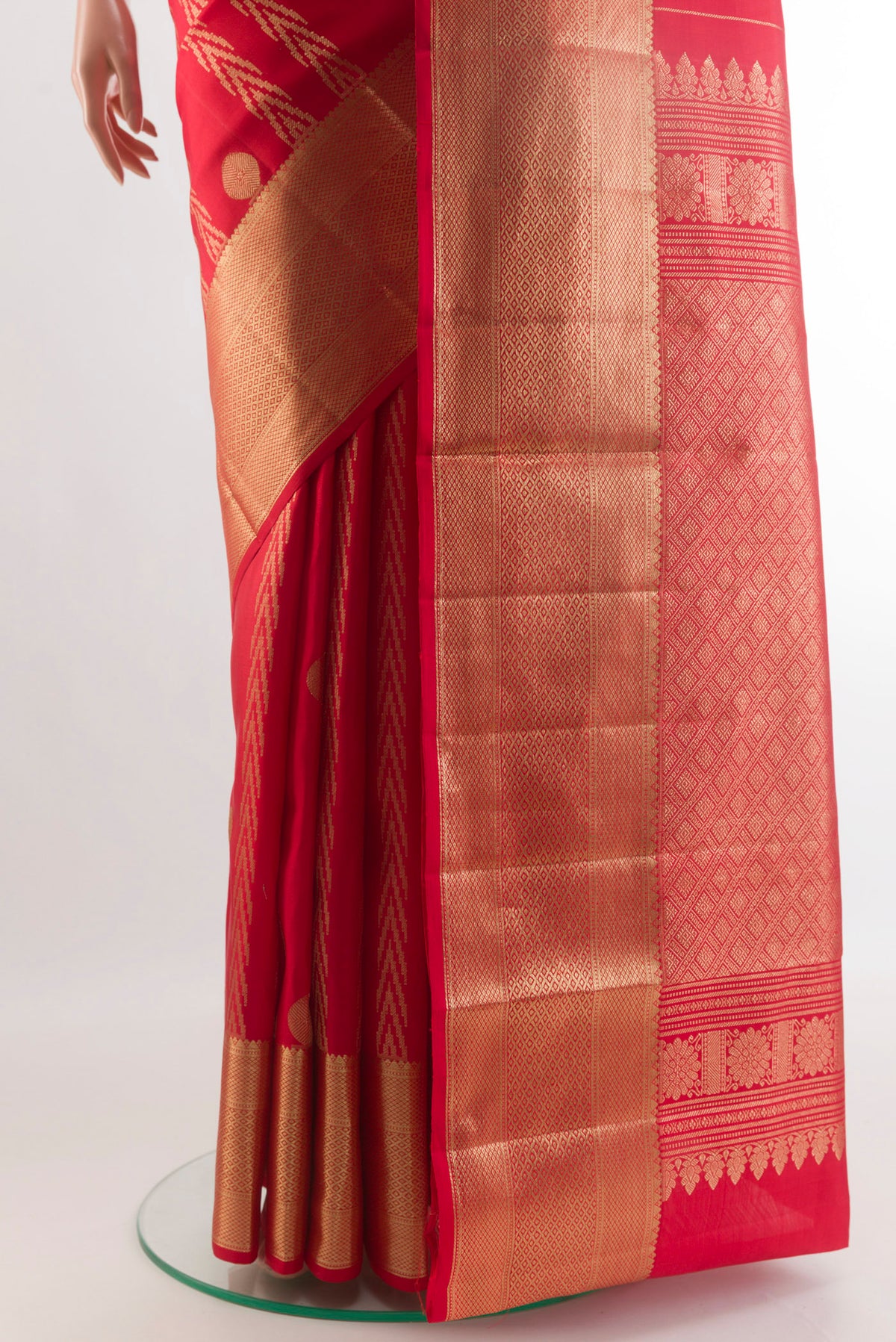 Pleats and pallu of Red Kanjivaram Silk Saree with Zari Butta on the body and Zari Border. 