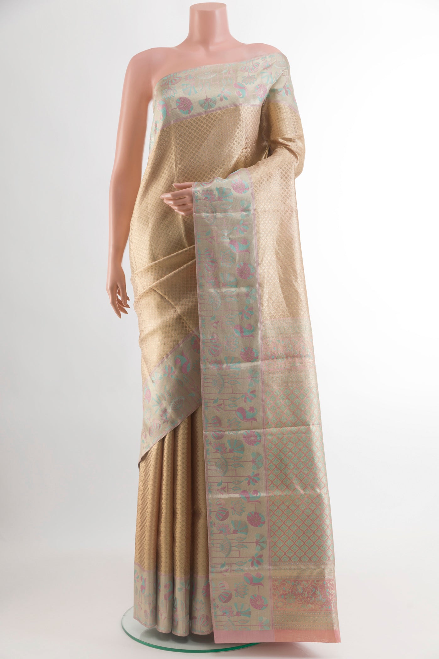 Golden Kanjivaram Tissue Silk Saree with Zari Brocade on the body and Zari Border.  displayed on a mannequin
