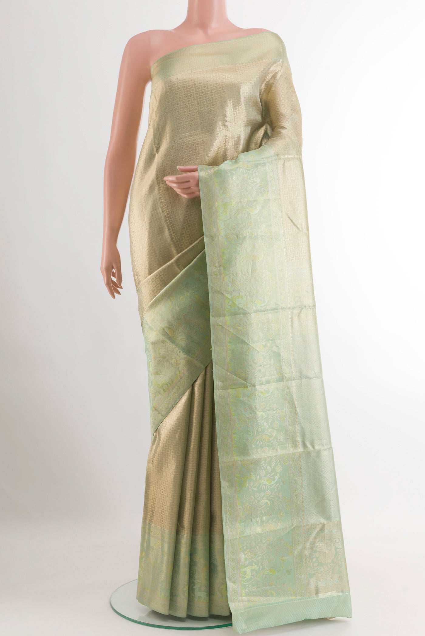 Sea Green Kanjivaram Tissue Silk Saree with Zari Brocade on the body and Zari Border.  displayed on a mannequin