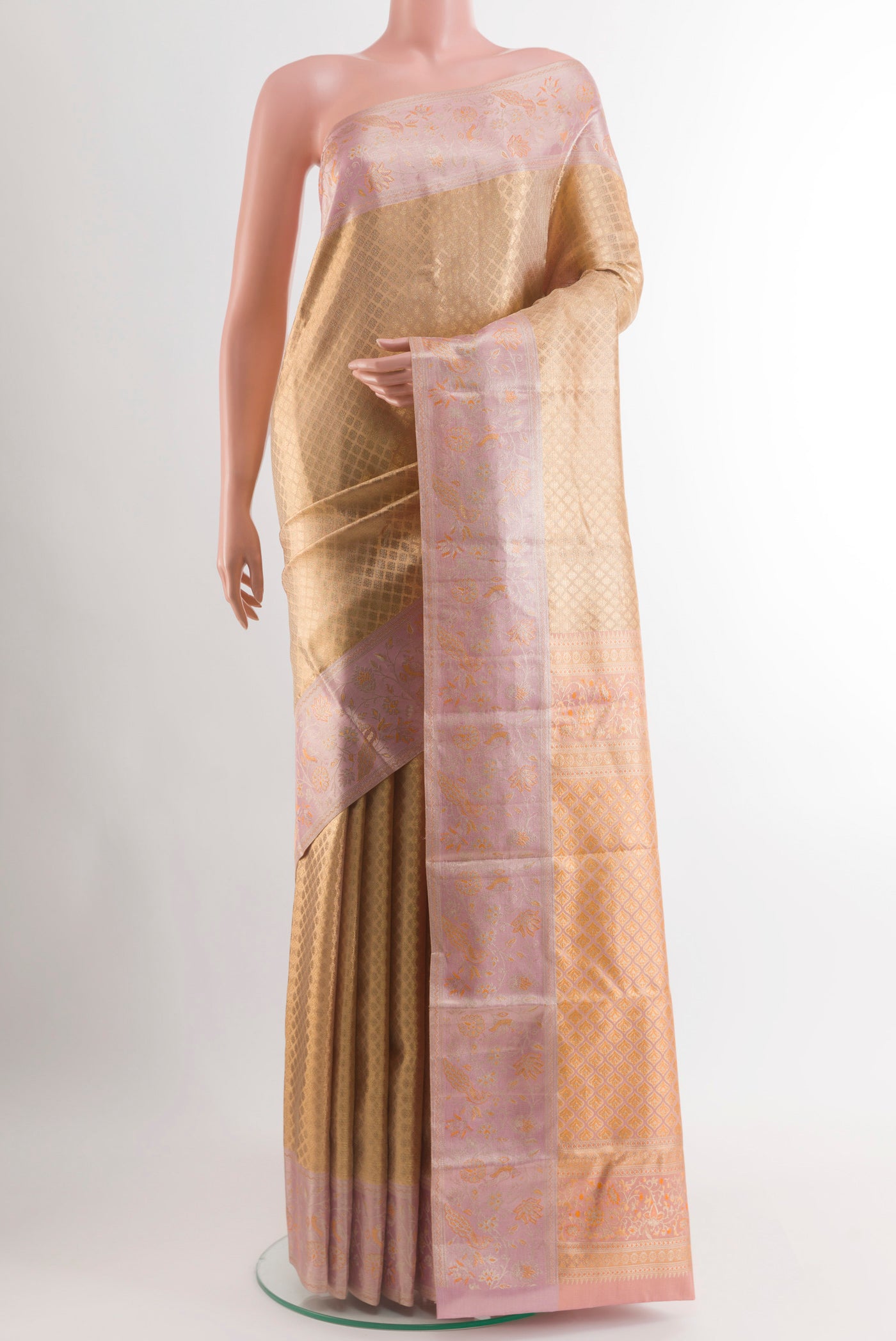 Golden Dual Tone Kanjivaram Tissue Silk Saree with Zari Brocade on the body and Zari Border.  displayed on a mannequin