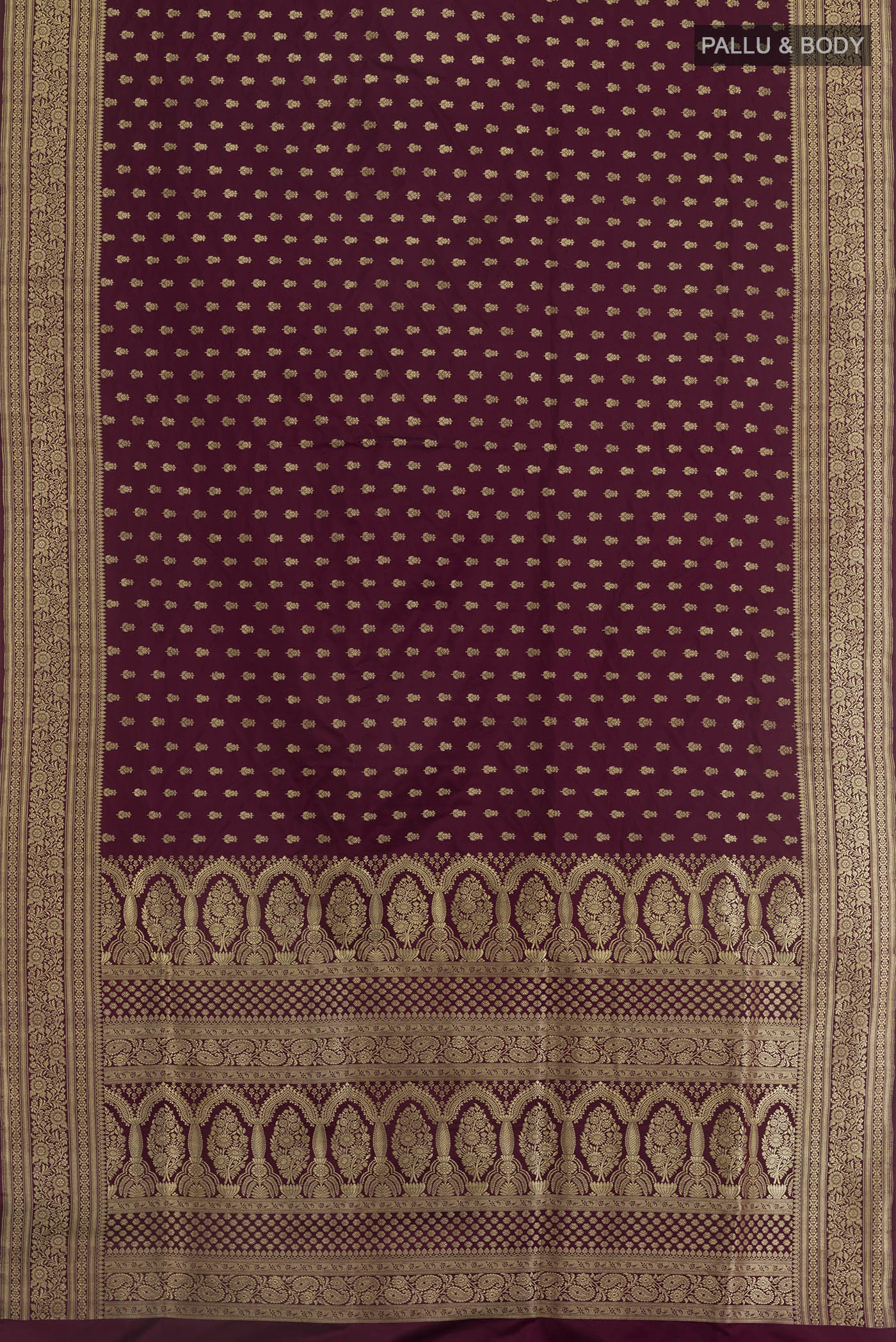 Flat view of Purple Banarasi Silk Saree with Zari Brocade on the body and Zari Border. 