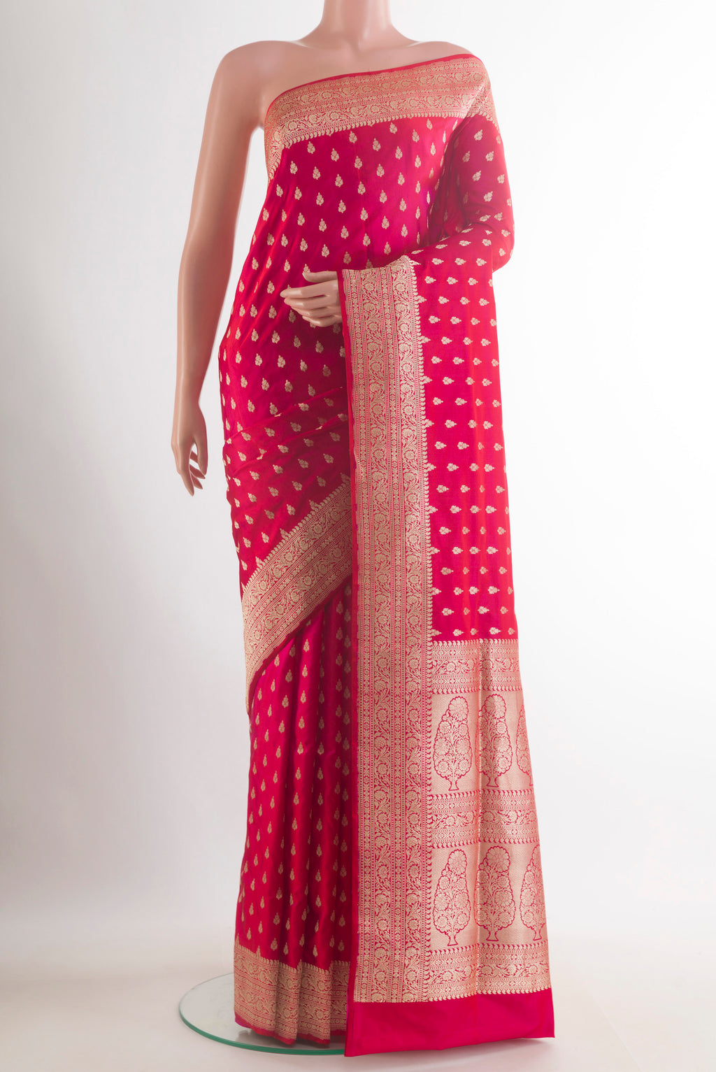 Red Banarasi Saree with Zari Butta on the body and Zari Border.  displayed on a mannequin