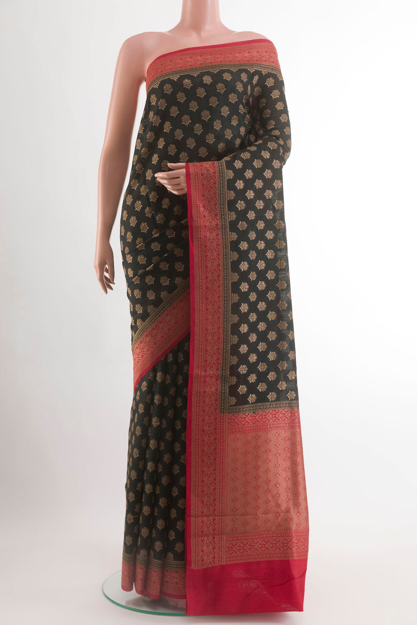 Black Tussar Silk Saree with Zari Butta on the body and Zari Border.  displayed on a mannequin