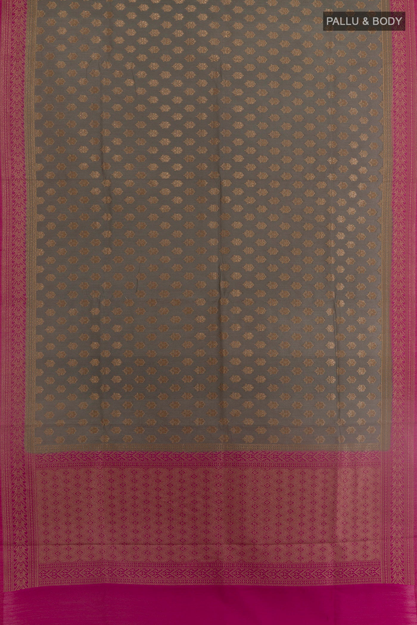 Flat view of Grey Tussar Silk Saree with Zari Butta on the body and Zari Border. 