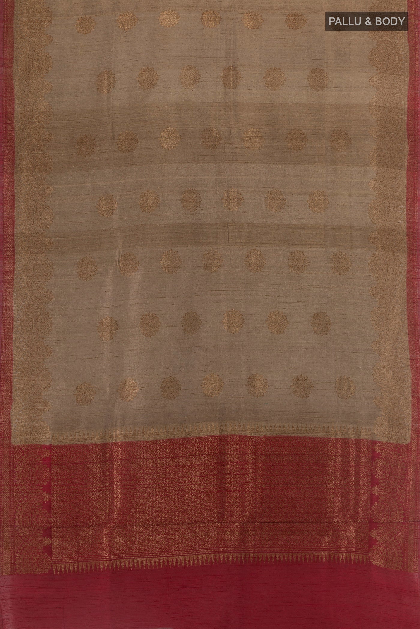 Flat view of Brown Banarasi Tussar Silk Saree with Zari Butta on the body and Zari Border. 
