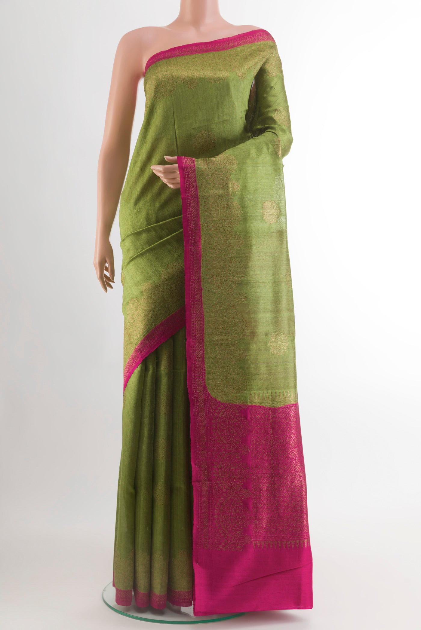 Green Banarasi Tussar Silk Saree with Zari Butta on the body and Zari Border.  displayed on a mannequin