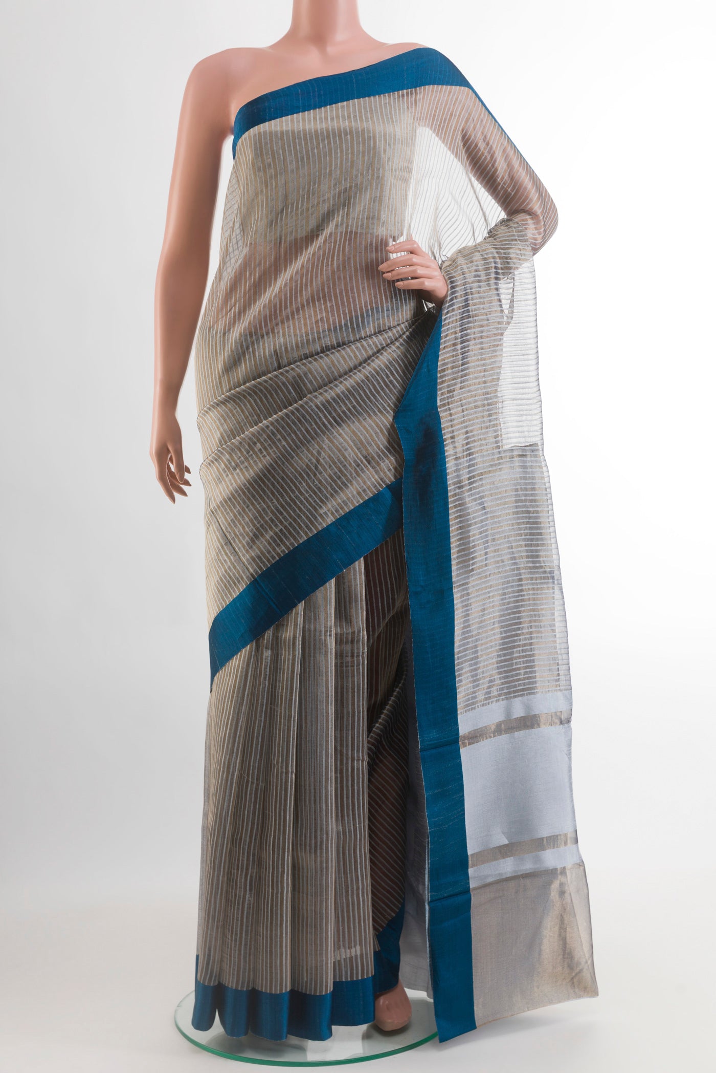 Grey Banarasi Tussar Silk Saree with Stripes on the body and Plain Border.  displayed on a mannequin