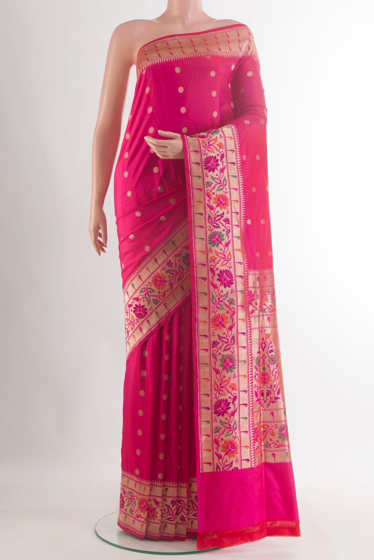 Pure Silk Pink Banarasi Saree with Zari Butta on the body and Zari Border.  displayed on a mannequin
