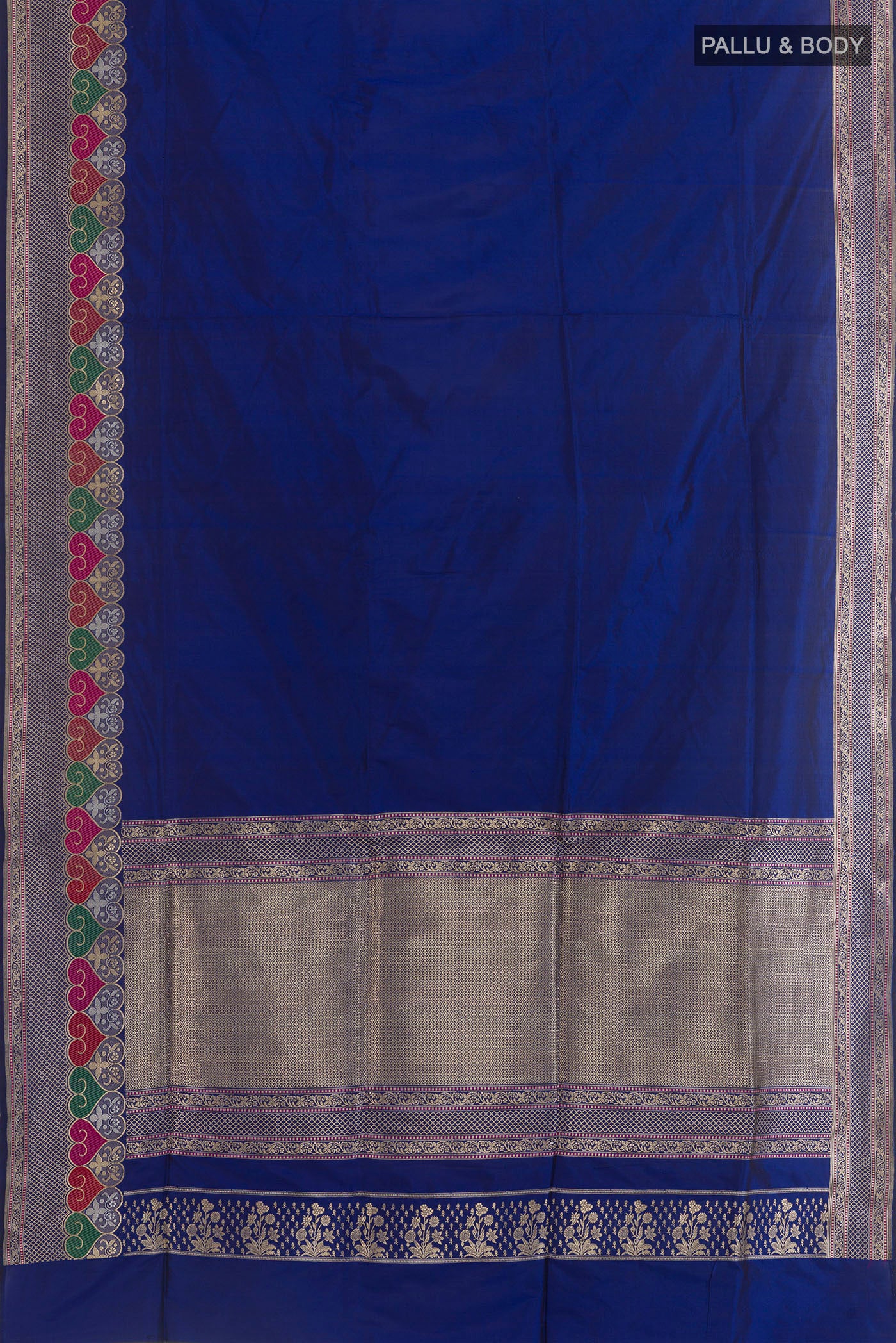 Flat view of Blue Banarasi Silk Saree with Plain Body and Zari Border. 
