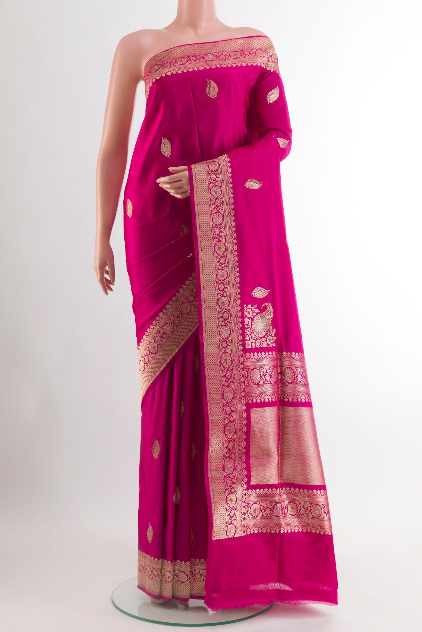 Rani Pink Banarasi Silk Saree with Zari Butta on the body and Zari Border.  displayed on a mannequin