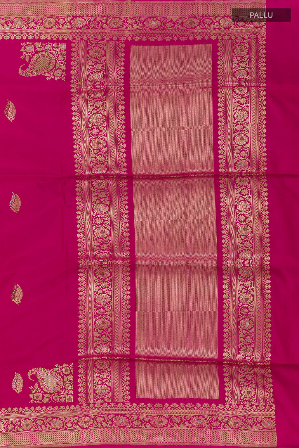 Close up image of the pallu of Rani Pink Banarasi Silk Saree with Zari Butta on the body and Zari Border. 
