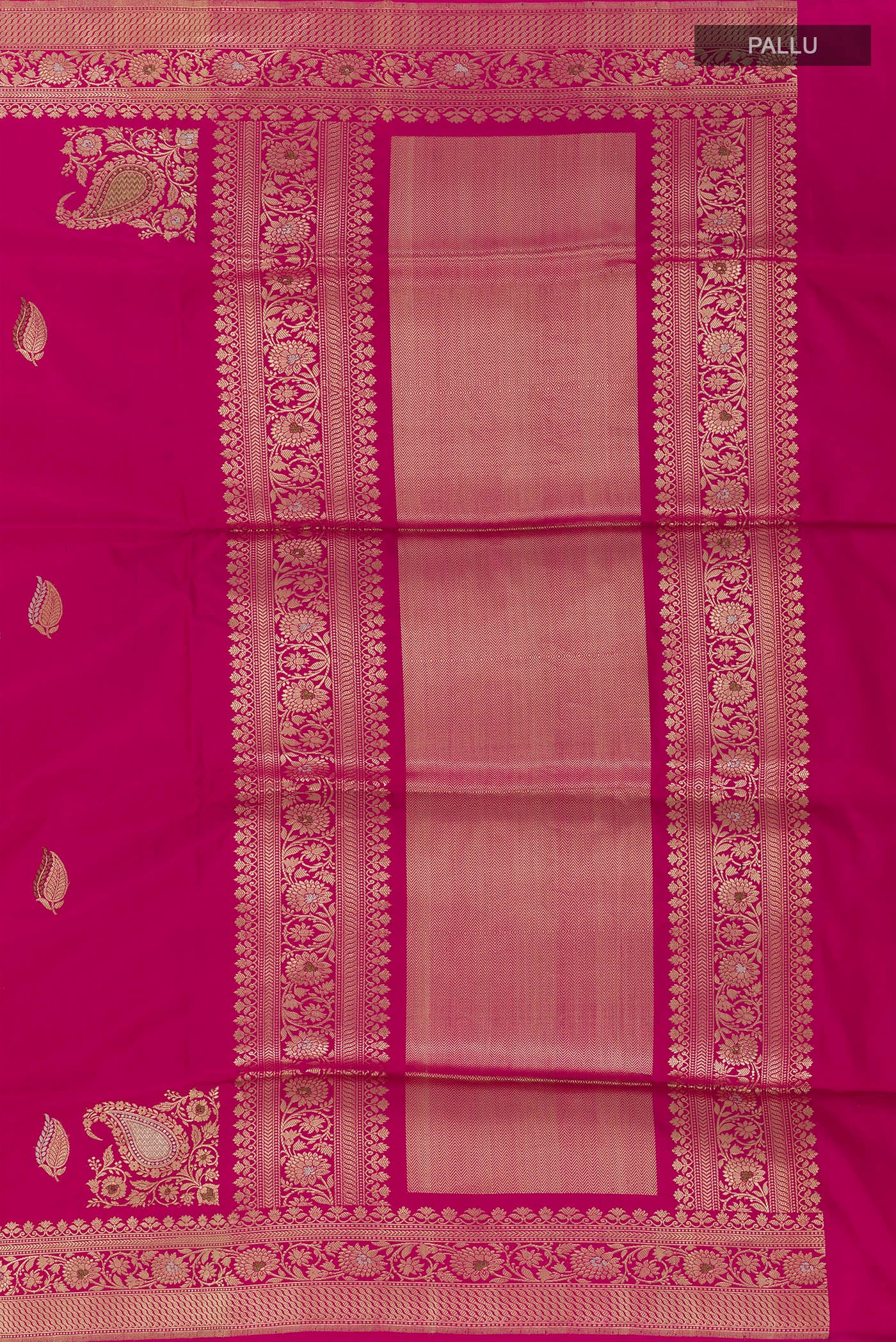Close up image of the pallu of Rani Pink Banarasi Silk Saree with Zari Butta on the body and Zari Border. 