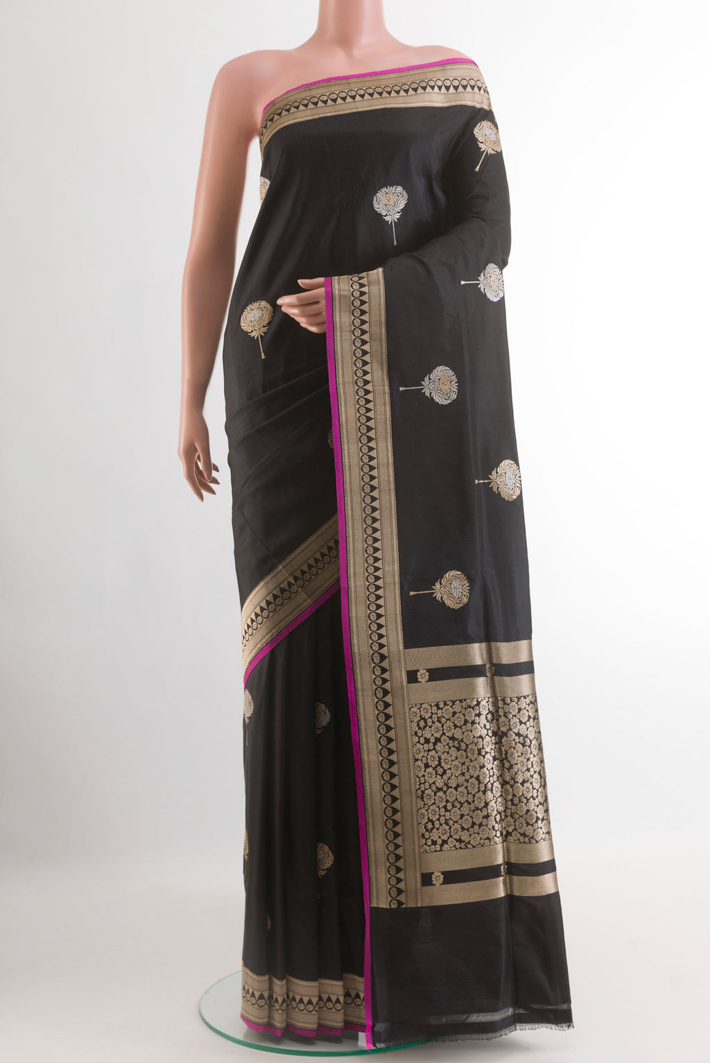 Black Banarasi Silk Saree with Zari Butta on the body and Zari Border.  displayed on a mannequin