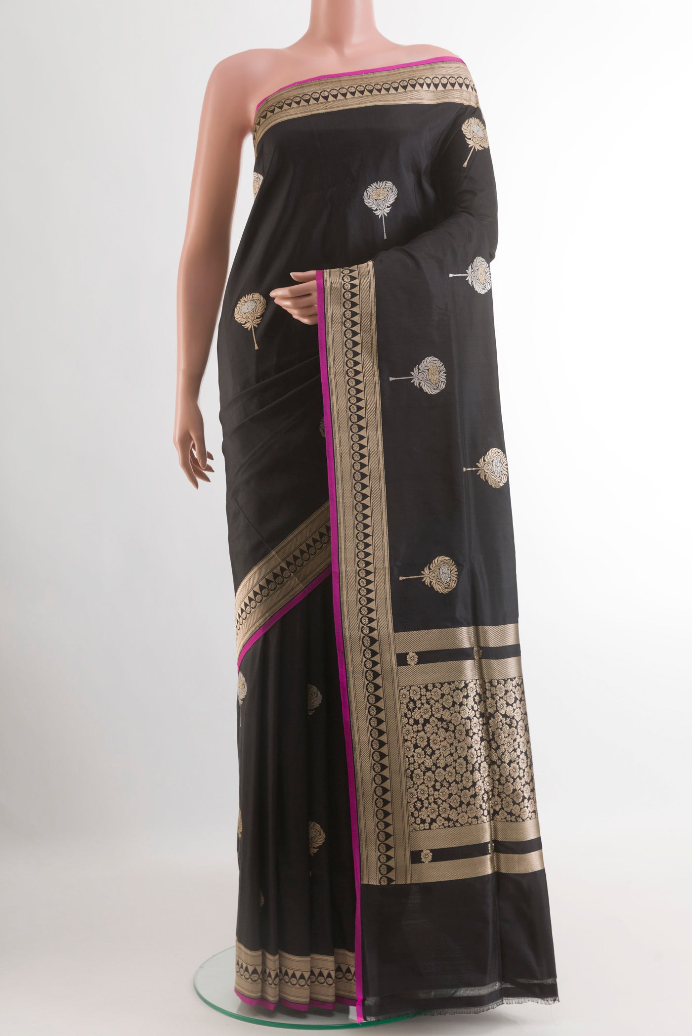 Black Banarasi Silk Saree with Zari Butta on the body and Zari Border.  displayed on a mannequin