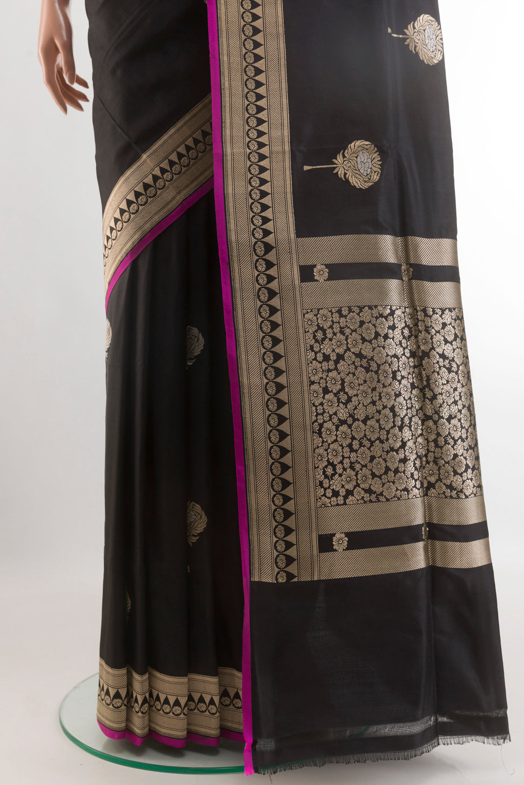 Pleats and pallu of Black Banarasi Silk Saree with Zari Butta on the body and Zari Border. 