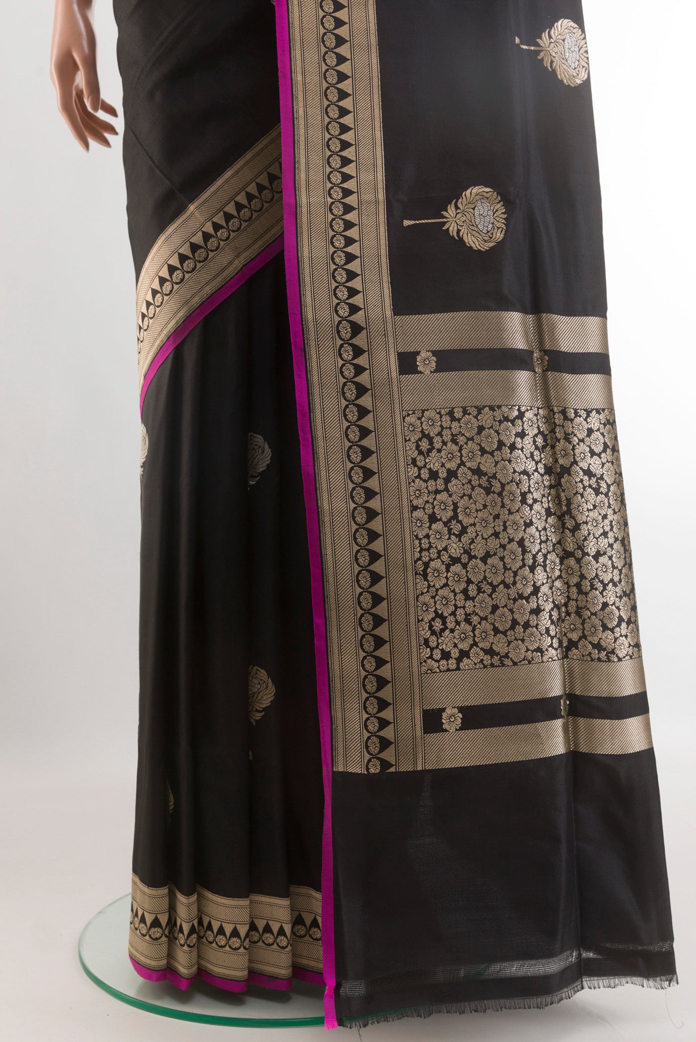 Pleats and pallu of Black Banarasi Silk Saree with Zari Butta on the body and Zari Border. 