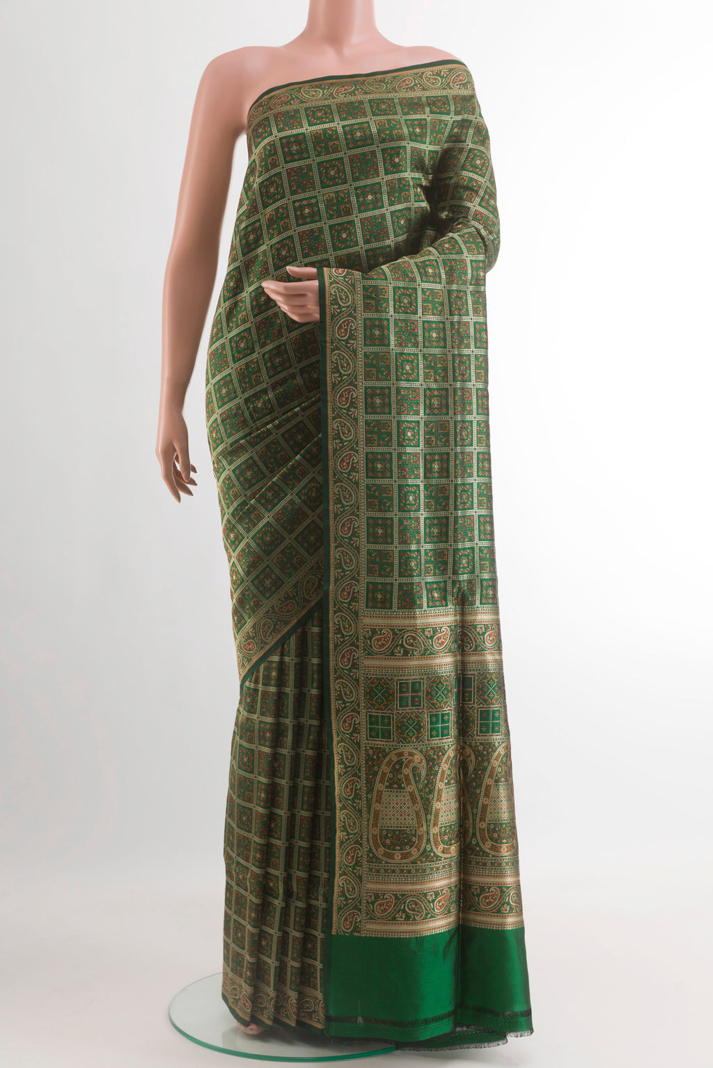 Green Banarasi Jamavar Saree with Jamdani on the body and Zari Border.  displayed on a mannequin
