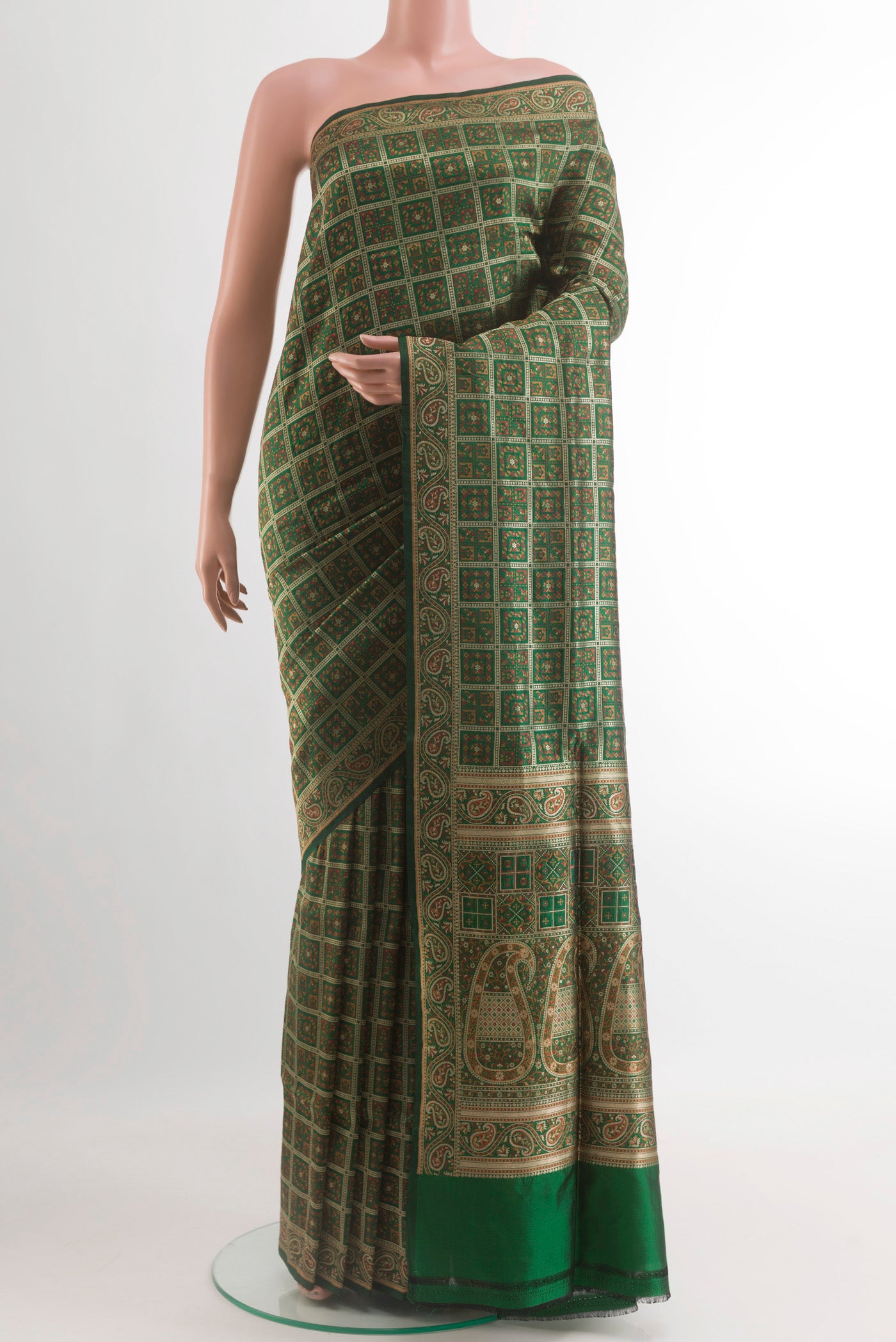 Green Banarasi Jamavar Saree with Jamdani on the body and Zari Border.  displayed on a mannequin