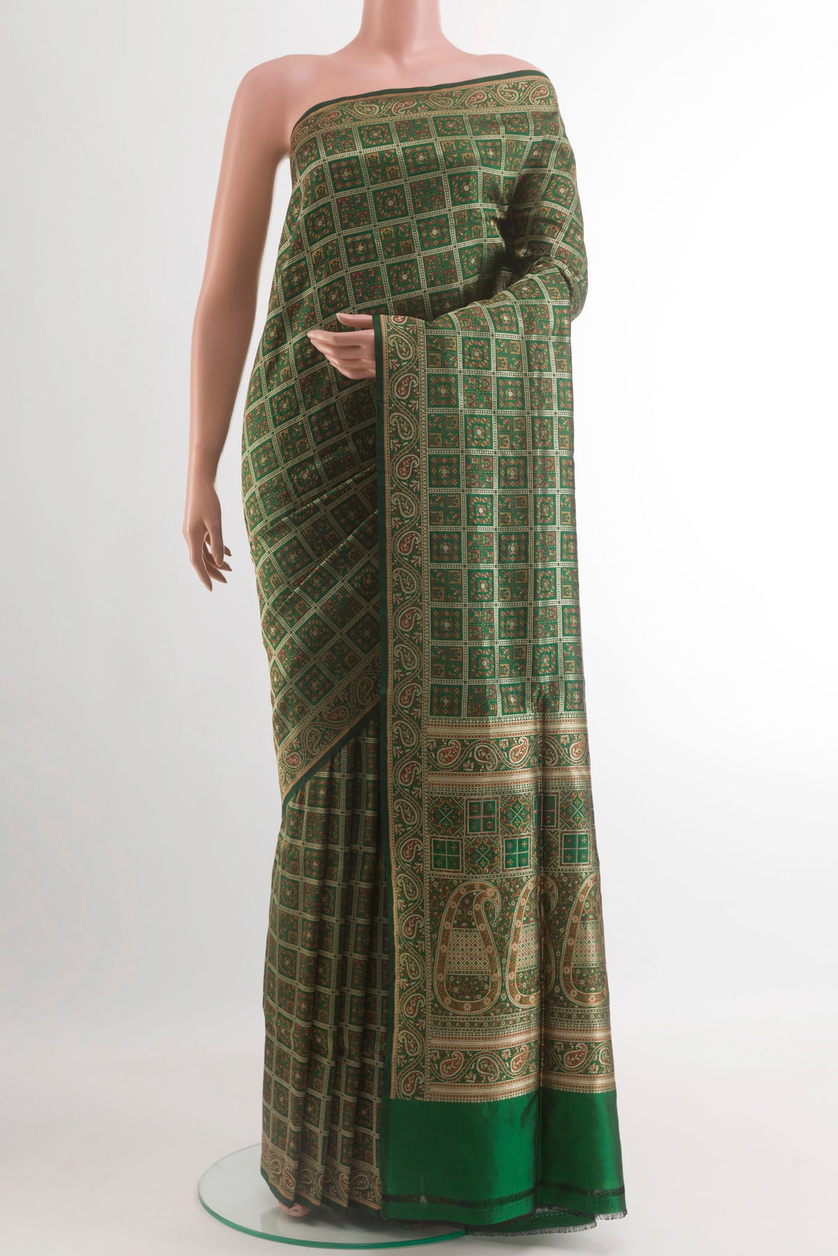 Green Banarasi Jamavar Saree with Jamdani on the body and Zari Border.  displayed on a mannequin