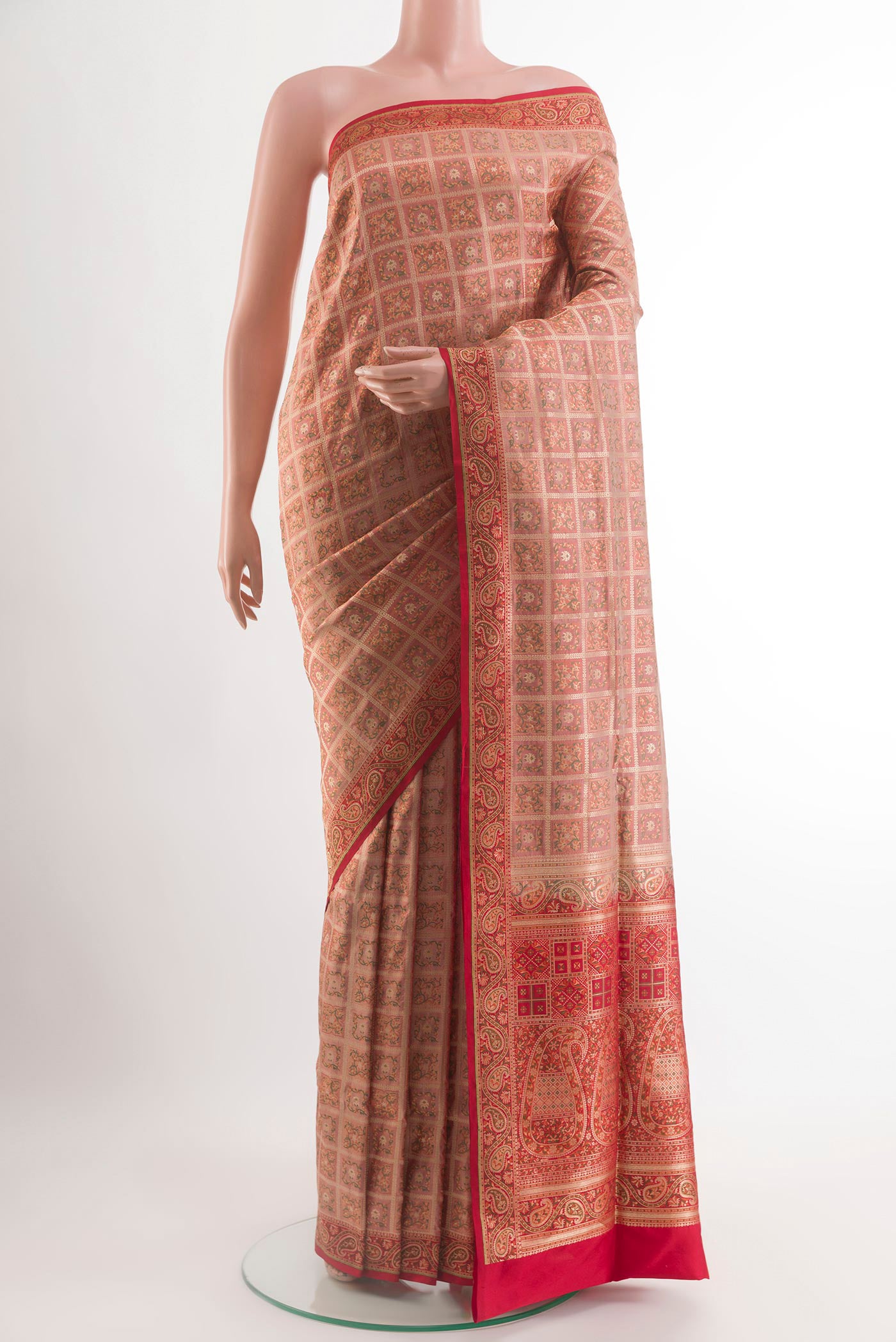 Rose Gold Banarasi Jamavar Saree with Jamdani on the body and Zari Border.  displayed on a mannequin