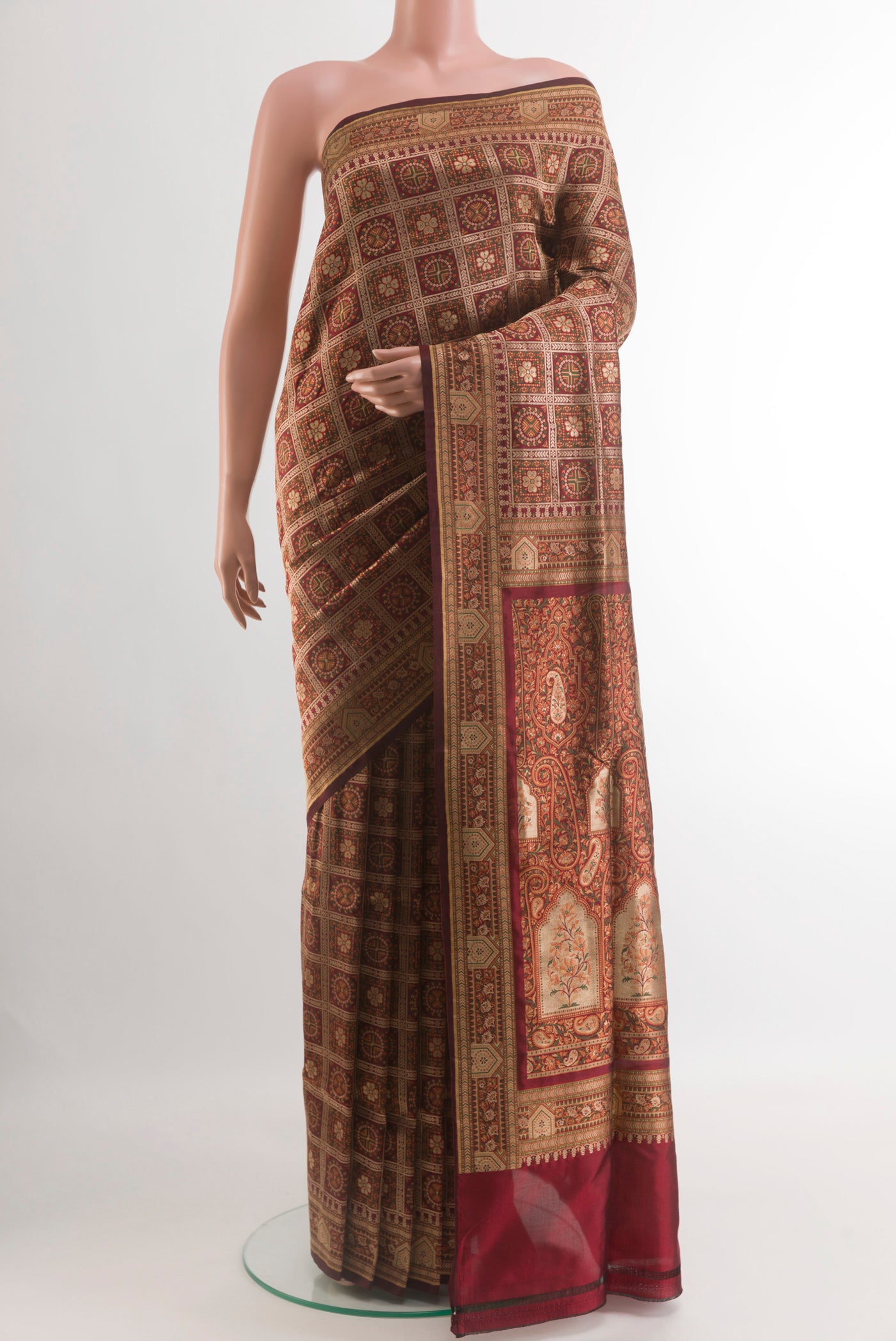 Maroon Banarasi Jamavar Saree with Jamdani on the body and Zari Border.  displayed on a mannequin