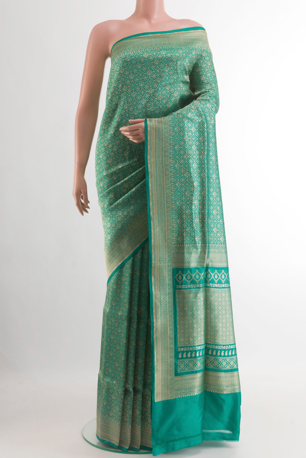 Teal Banarasi Silk Saree with Zari Brocade on the body and Zari Border.  displayed on a mannequin