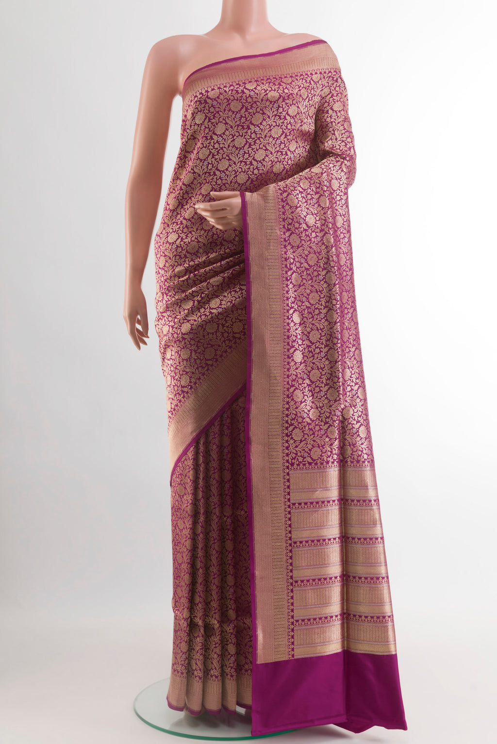 Magenta Banarasi Silk Saree with Zari Brocade on the body and Zari Border.  displayed on a mannequin