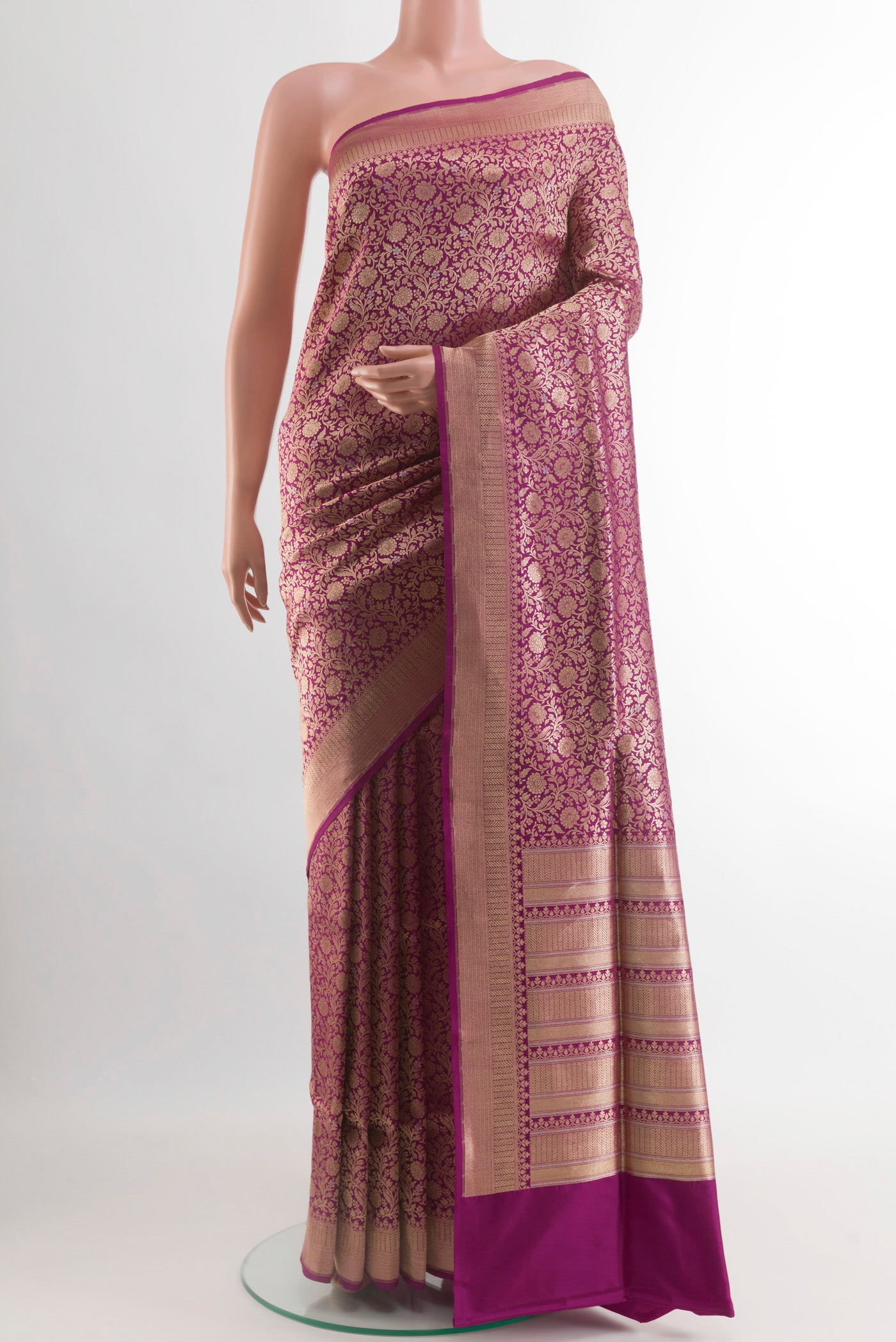 Magenta Banarasi Silk Saree with Zari Brocade on the body and Zari Border.  displayed on a mannequin