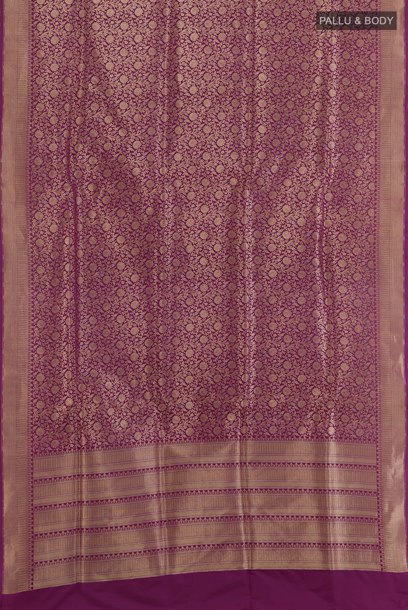 Flat view of Magenta Banarasi Silk Saree with Zari Brocade on the body and Zari Border. 
