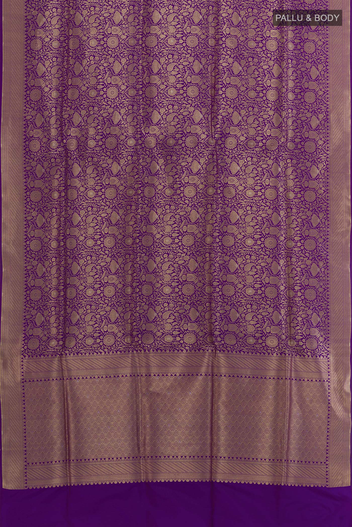 Flat view of Purple Banarasi Silk Saree with Zari Brocade on the body and Zari Border. 